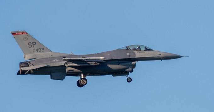 Fighter jet flying out responding to the small plane.