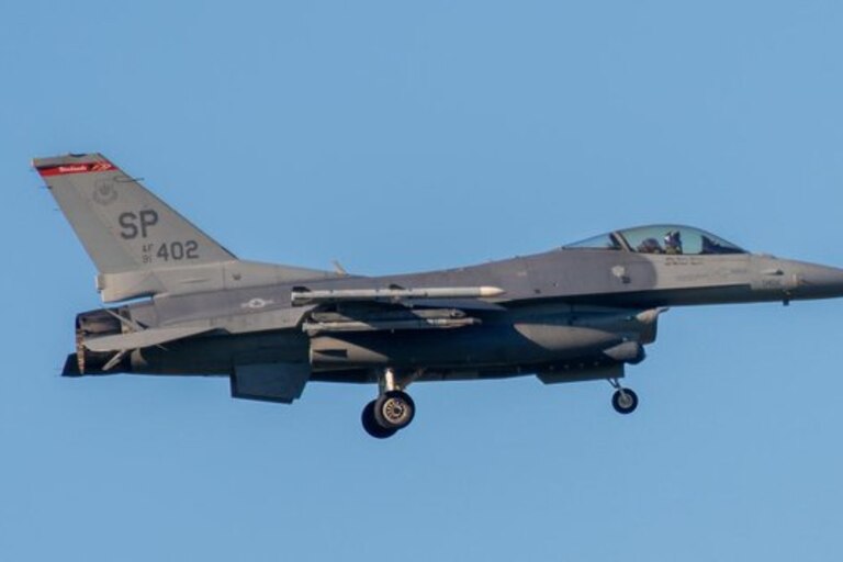 Fighter jet flying out responding to the small plane.