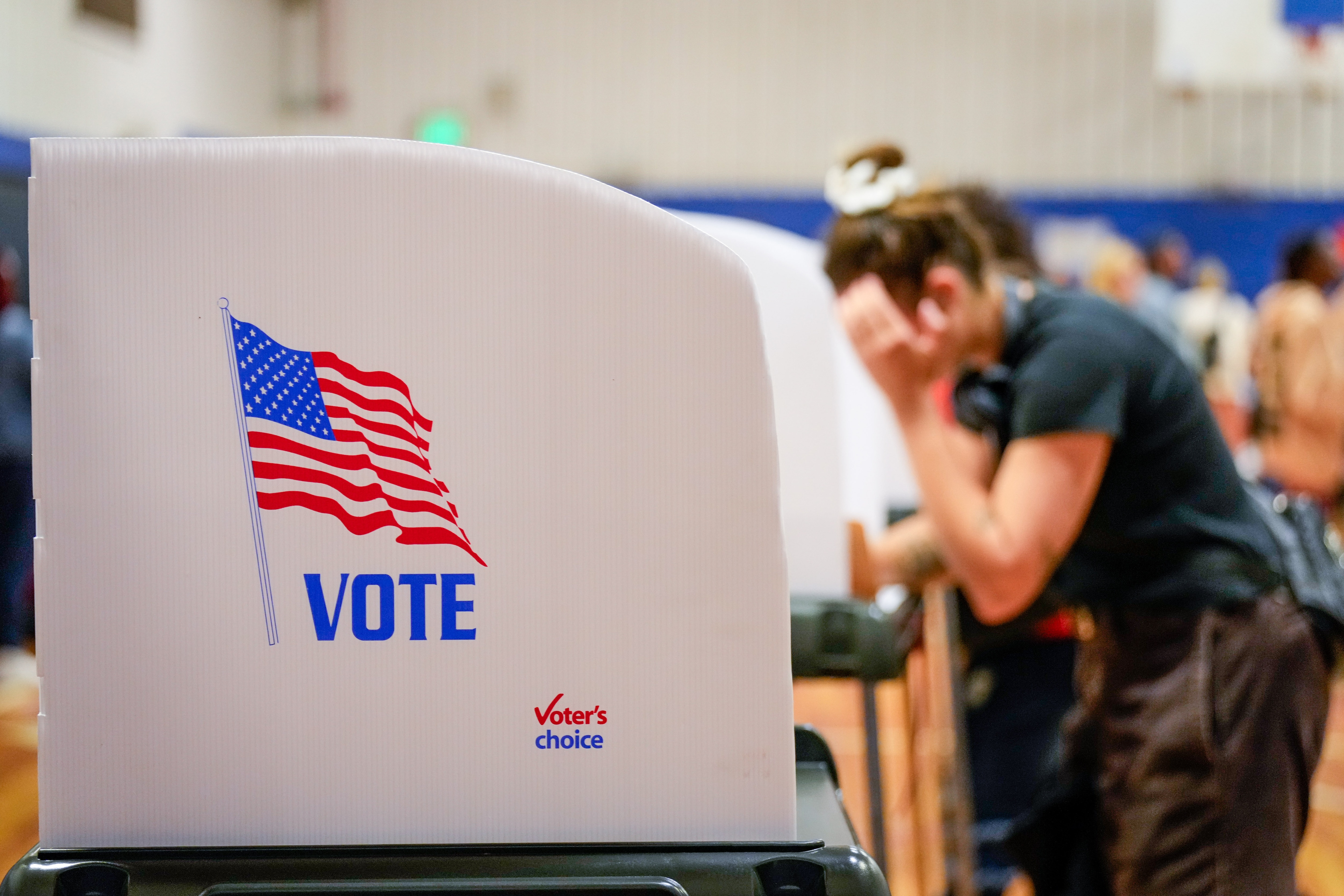 Baltimore residents cast their votes inside the polling location at Margaret Brent Elementary/Middle School on Election Day, Tuesday, November 5, 2024.