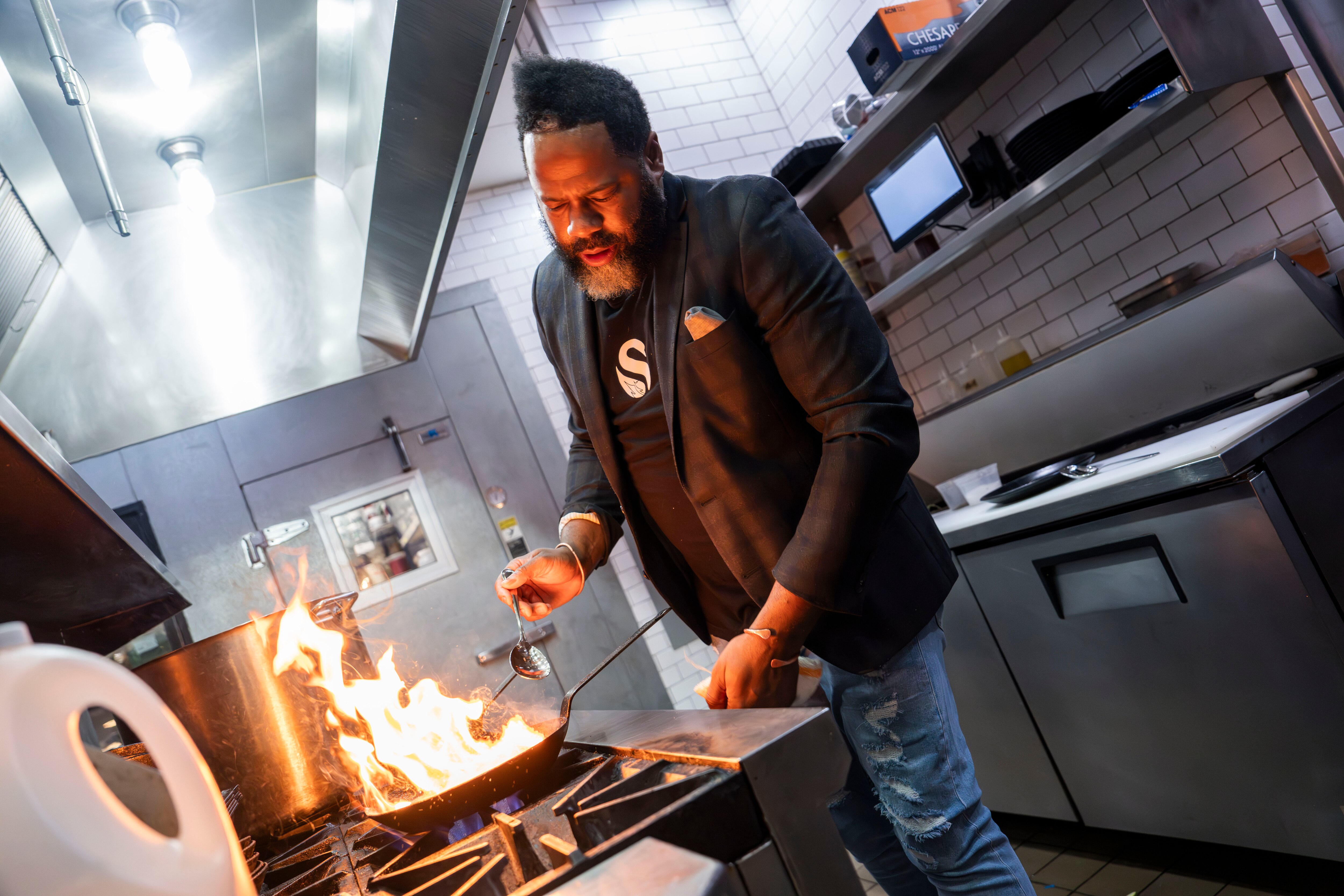 Chef Saon Brice, who hosts the Rare Bird Supper Club at Black Swan, creates a dish with duck and rooted vegetables on Nov. 8, 2023.