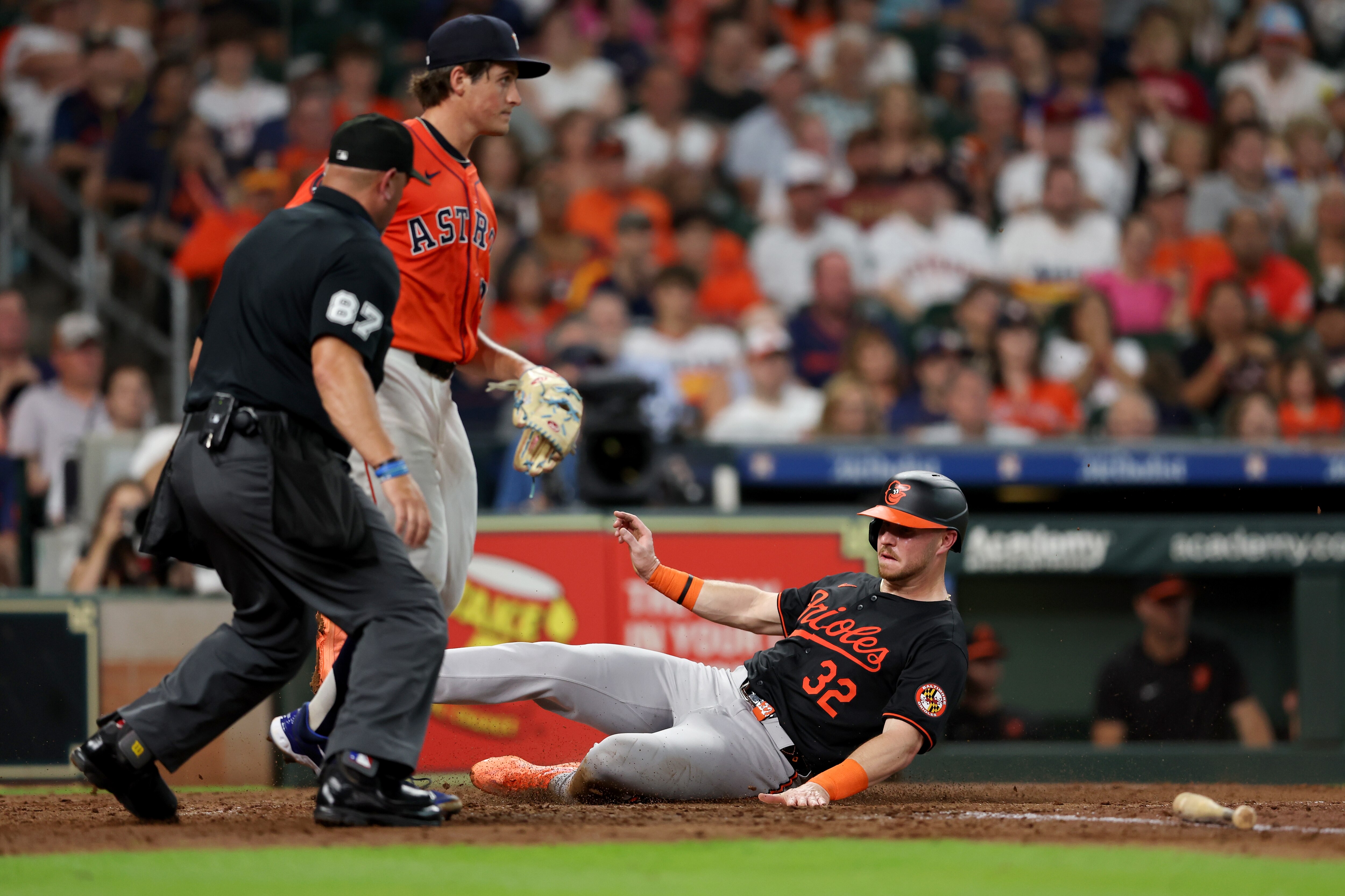 HOUSTON, TEXAS - JUNE 21: Ryan O'Hearn #32 of the Baltimore Orioles scores a run in the third inning against the Houston Astros at Minute Maid Park on June 21, 2024 in Houston, Texas. (Photo by Tim Warner/Getty Images)
