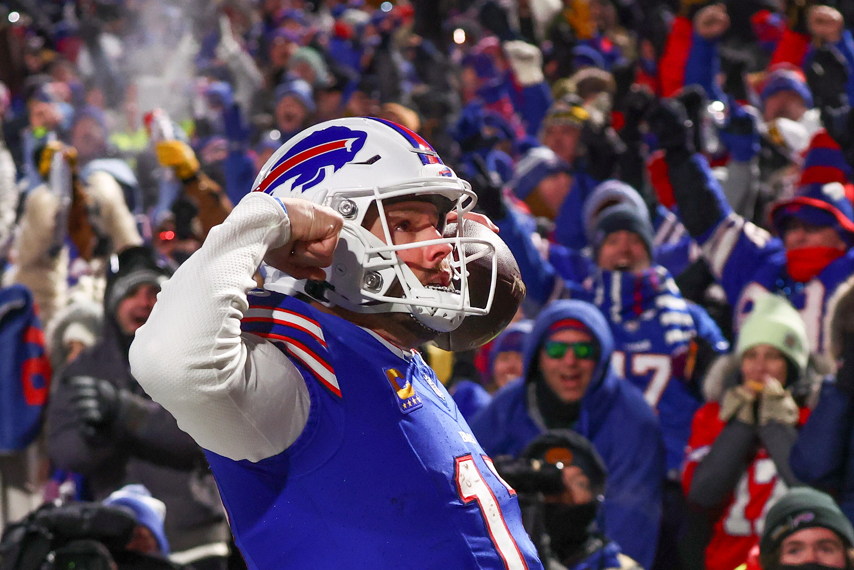 Buffalo Bills quarterback Josh Allen (17) reacts to the crowd after scoring a touchdown against the Pittsburgh Steelers during the second quarter of an NFL wild-card playoff football game, Monday, Jan. 15, 2024, in Buffalo, N.Y. (AP Photo/Adrian Kraus)