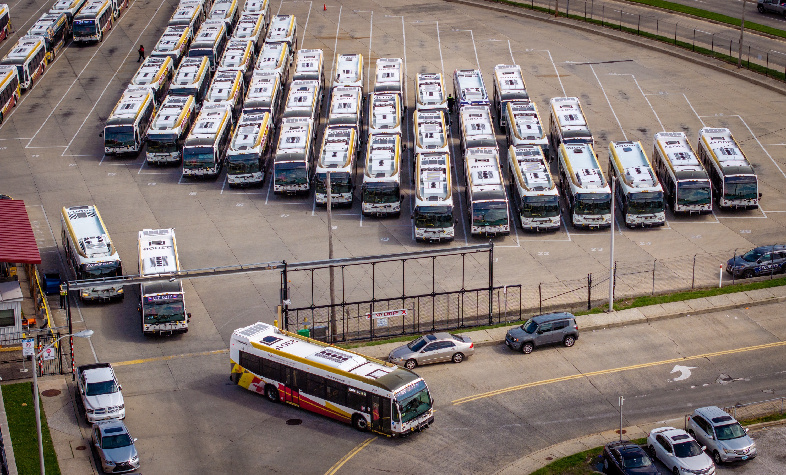 Buses leave the MTA’s Eastern Division bus lot on May 6, 2025.
