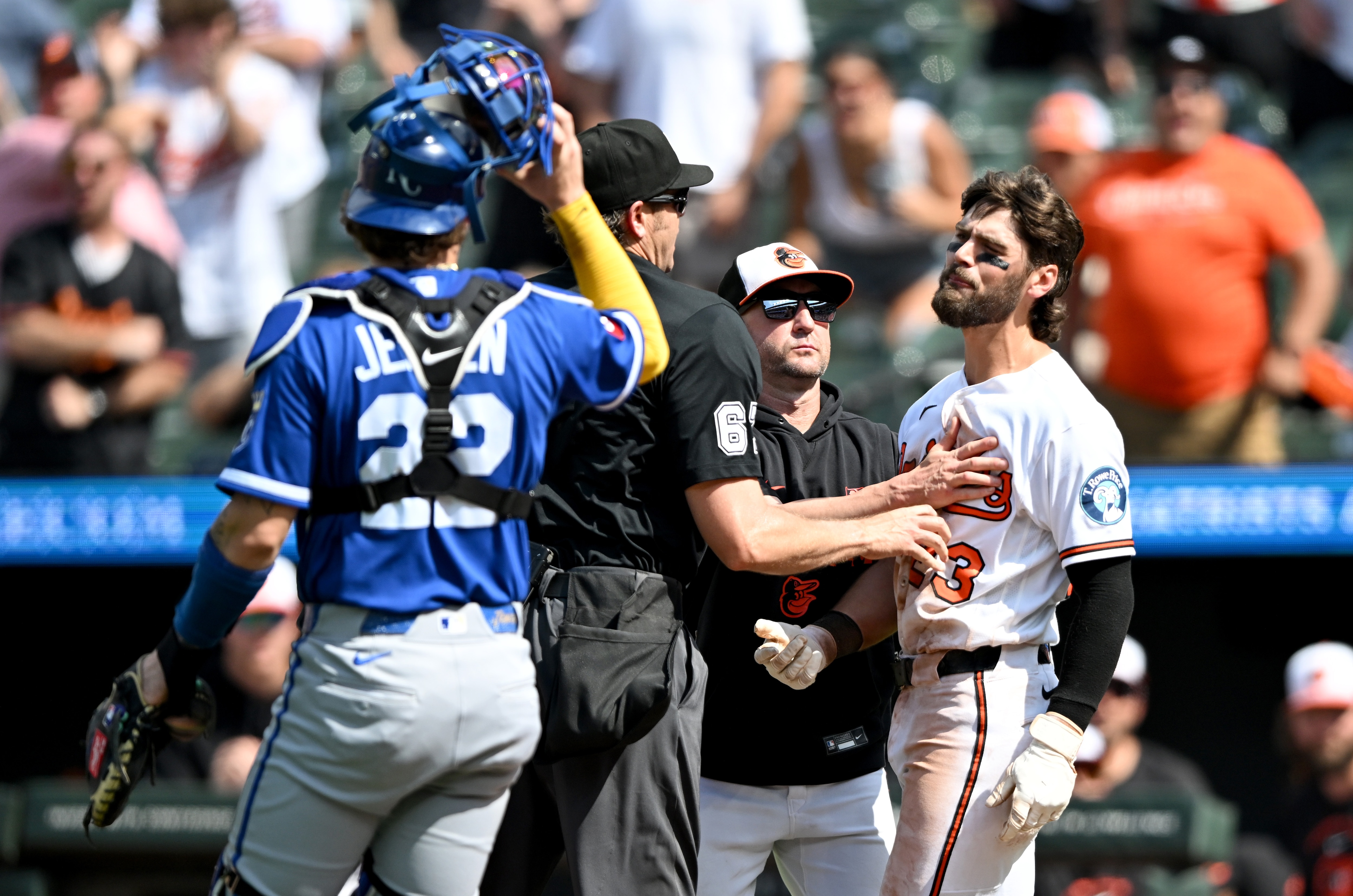 Blaze Alexander is held back by manager Craig Albernaz and umpire Ryan Additon after being hit by a pitch in the seventh inning Sunday.