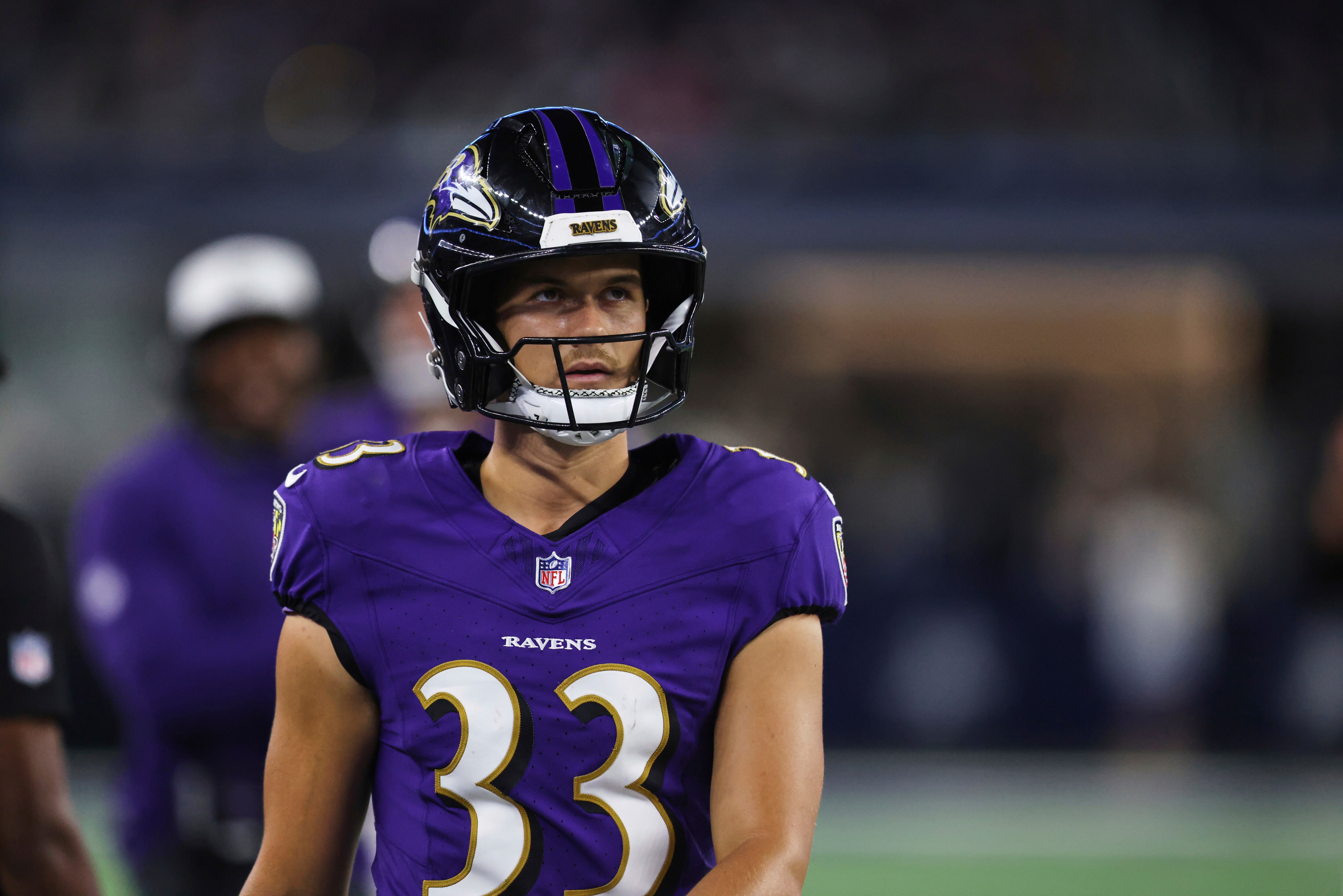 Baltimore Ravens place kicker Tyler Loop walks along the sideline in the second half of a preseason NFL football game against the Dallas Cowboys