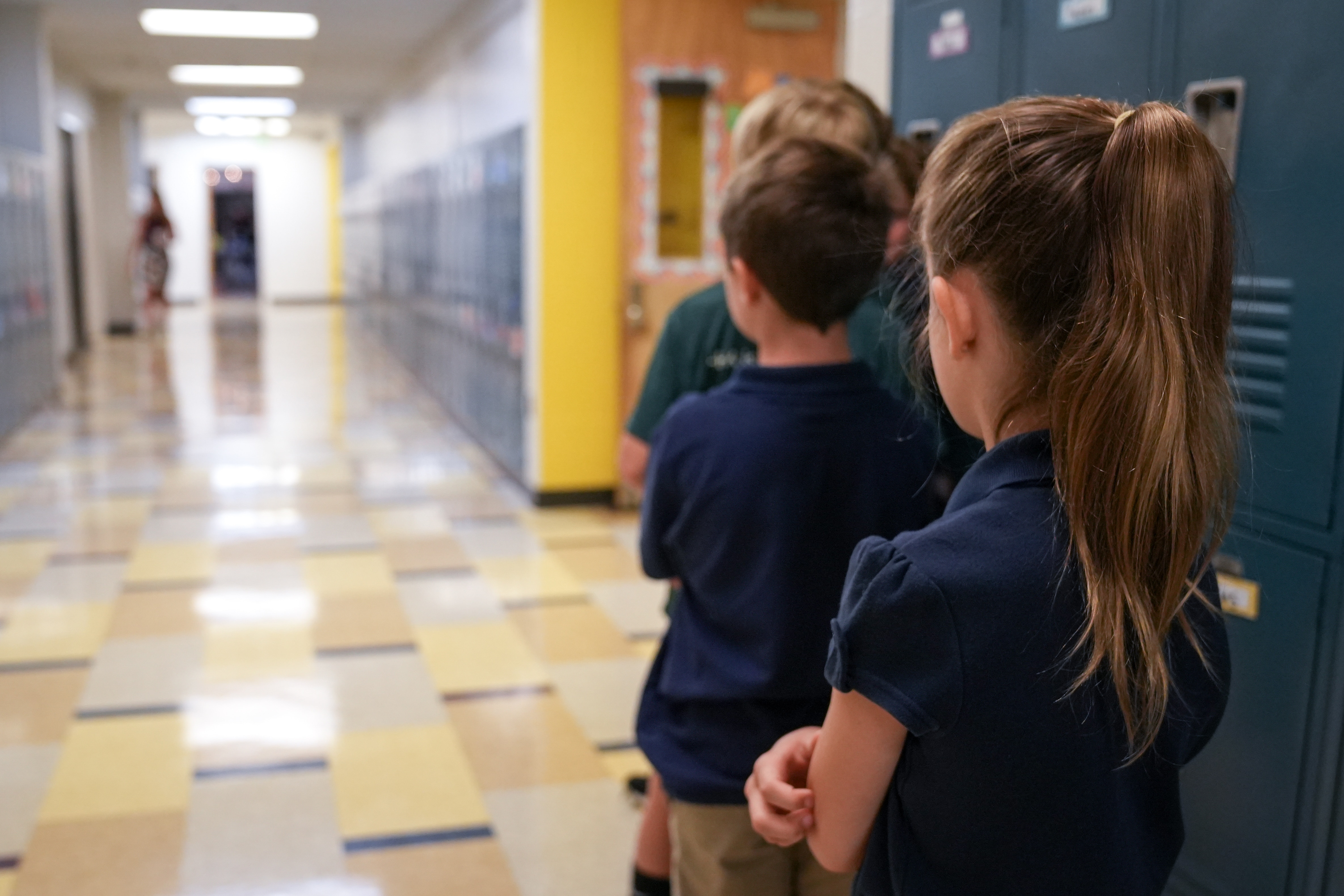 Students stand together by their lockers inside Hampstead Hill Academy on 8/29/22. Monday was the first day back to school for Baltimore City students.