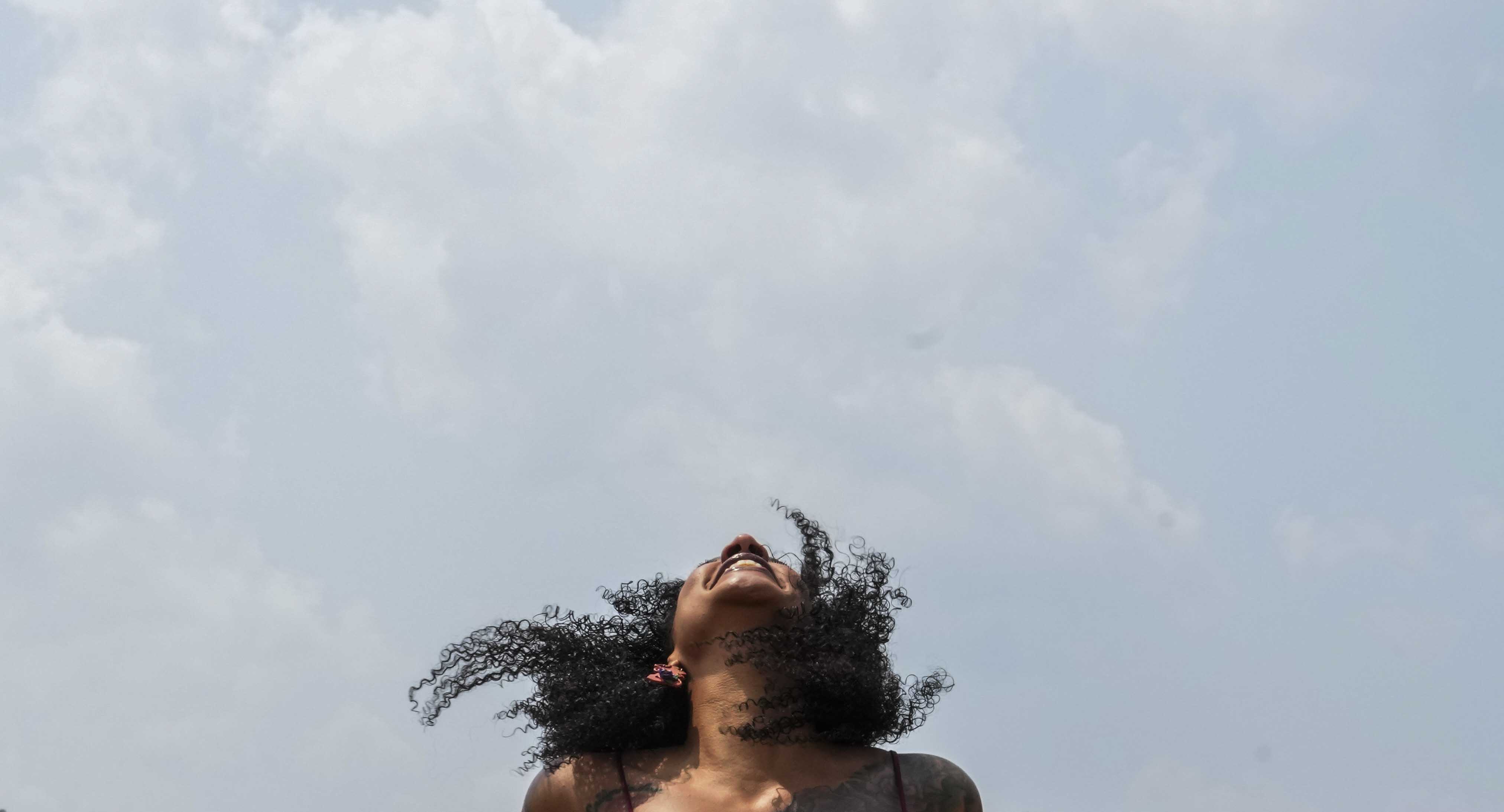 Cali Leahy, 40, dances at AFRAM Juneteenth Festival on June 17, 2023 at Druid Hill Park. This is the first official Baltimore Club Music Day.