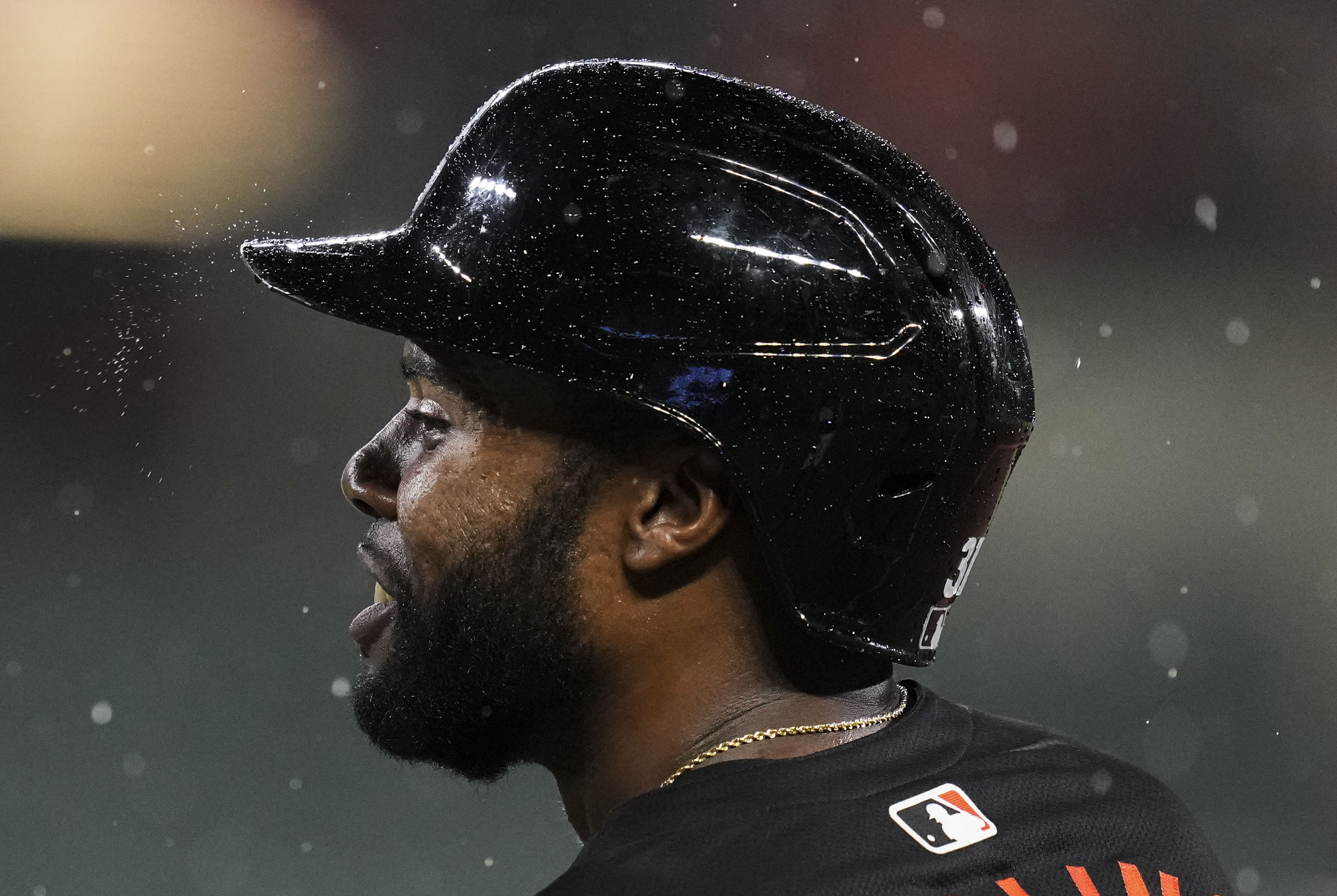 Orioles outfielder Cedric Mullins stands at first base in the rain during Friday’s game against the Colorado Rockies.