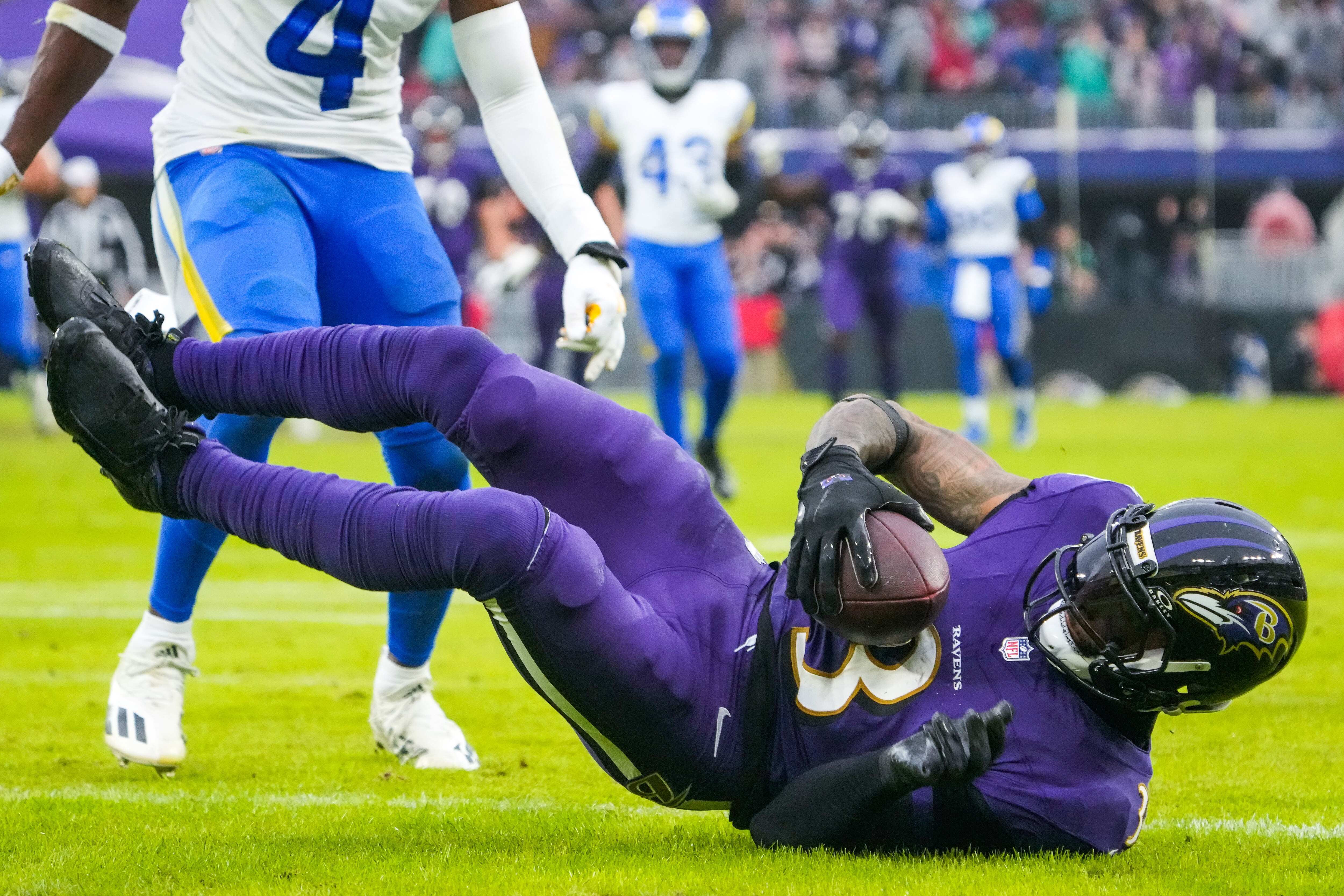Ravens wide receiver Odell Beckham Jr. rolls into the end zone on a 46-yard touchdown reception in the second quarter of Sunday's 37-31 overtime win over the Rams.