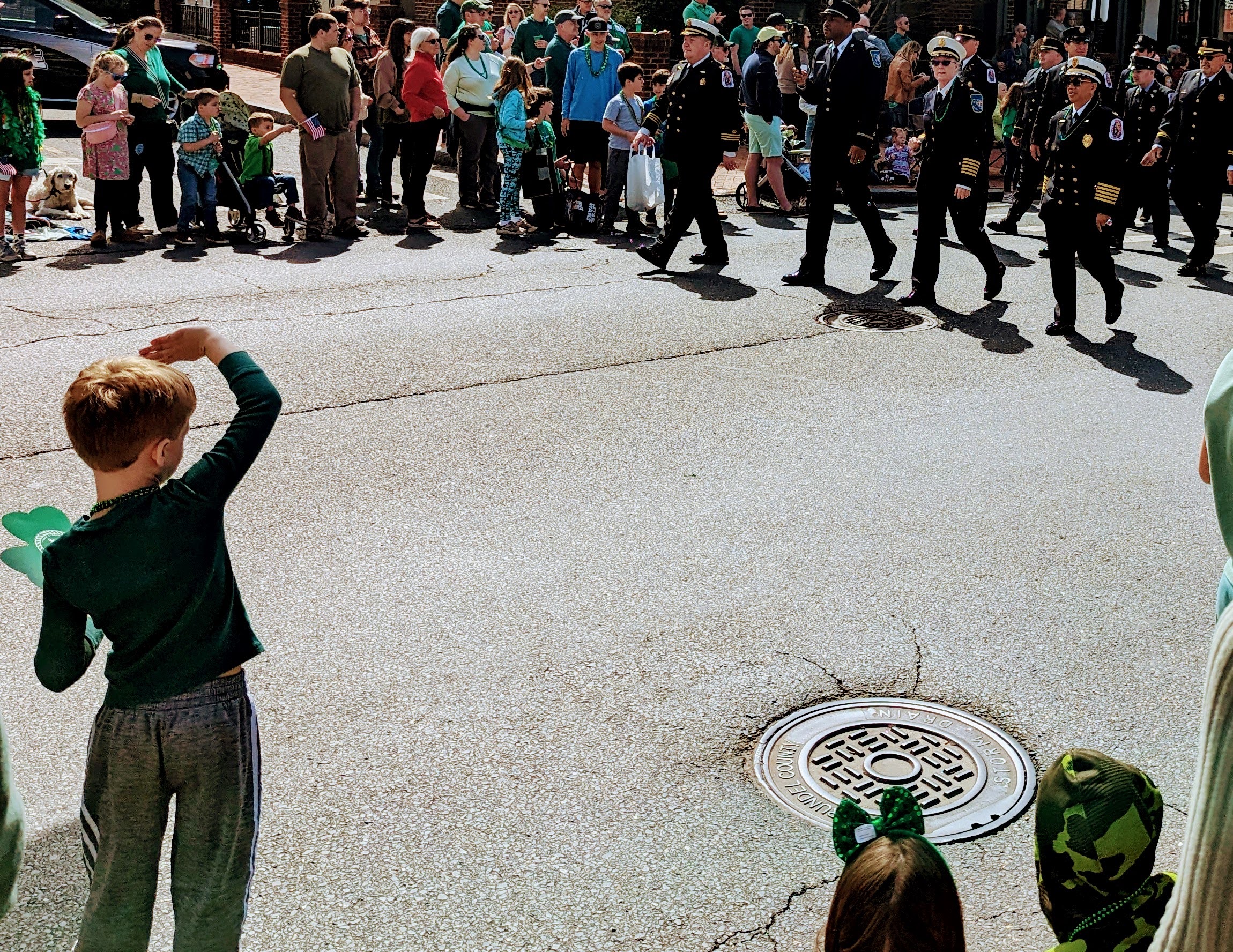 A young boy watches as a unit of marching firefighters passes by during Annapolis St. Patrick's Parade on March 17, 2024. The popular event returns Sunday.