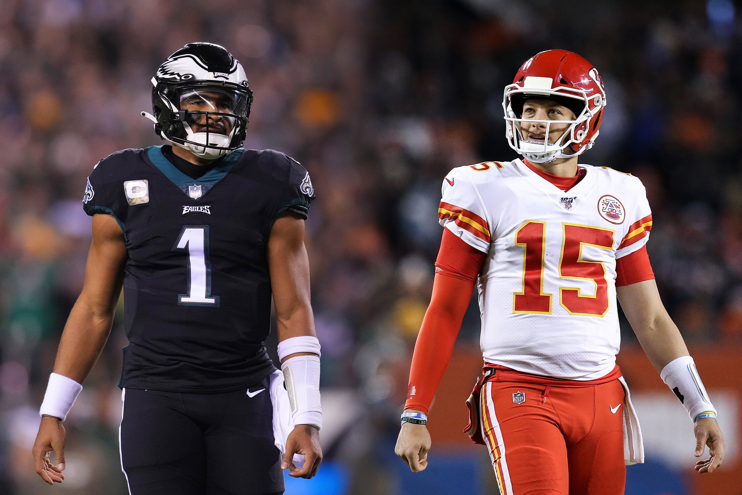 FILE PHOTO (EDITOR'S NOTE: COMPOSITE OF IMAGES - Image numbers 1445115801, 1195611619 - GRADIENT ADDED) In this composite image a comparison has been made between quarterback Jalen Hurts #1 of the Philadelphia Eagles (L) and quarterback Patrick Mahomes #15 of the Kansas City Chiefs (R). They will meet in Super Bowl LVII on February 12,2023 at State Farm Stadium in Glendale, Arizona. ***LEFT IMAGE PHILADELPHIA, PA - NOVEMBER 27: Jalen Hurts #1 of the Philadelphia Eagles looks on against the Green Bay Packers at Lincoln Financial Field on November 27, 2022 in Philadelphia, Pennsylvania. (Photo by Mitchell Leff/Getty Images) ***RIGHT IMAGE CHICAGO, ILLINOIS - DECEMBER 22: Patrick Mahomes #15 of the Kansas City Chiefs walks across the field in the third quarter against the Chicago Bears at Soldier Field on December 22, 2019 in Chicago, Illinois.