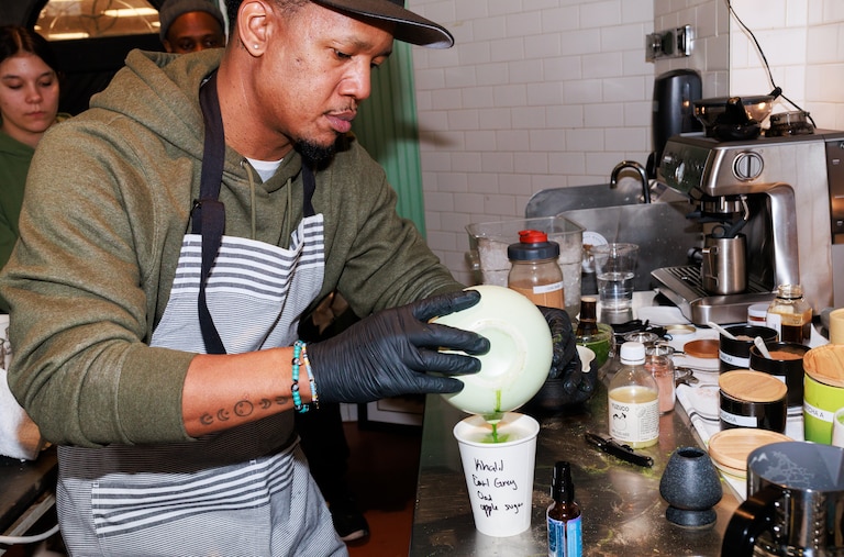 Equitea owner Quentin Vennie makes a matcha drink during the opening part of his month-long matcha shop pop up in the Remington neighborhood of Baltimore, MD on Feb. 22, 2025.
