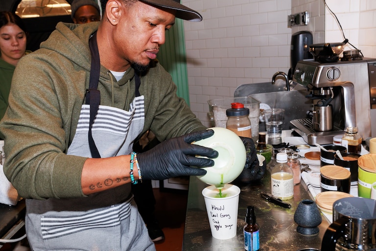 Equitea owner Quentin Vennie makes a matcha drink during the opening part of his month-long matcha shop pop up in the Remington neighborhood of Baltimore, MD on Feb. 22, 2025.