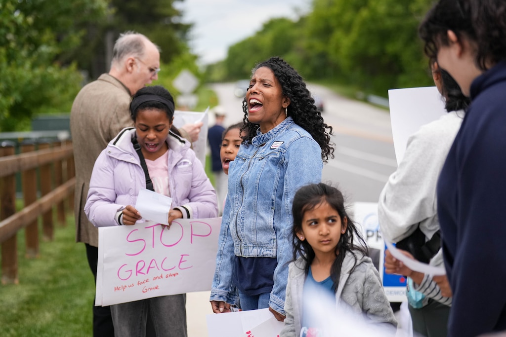 Shamieka Preston, center, a candidate for Howard County Council, leads a chant with the Stop Grace Coalition during a rally down the street from the W.R. Grace headquarters in Columbia, Md. on Thursday, May 14, 2026. The group is applying pressure on the county Board of Appeals to release a written decision on their rejection of the Stop Grace Coalition’s September 2025 complaint.