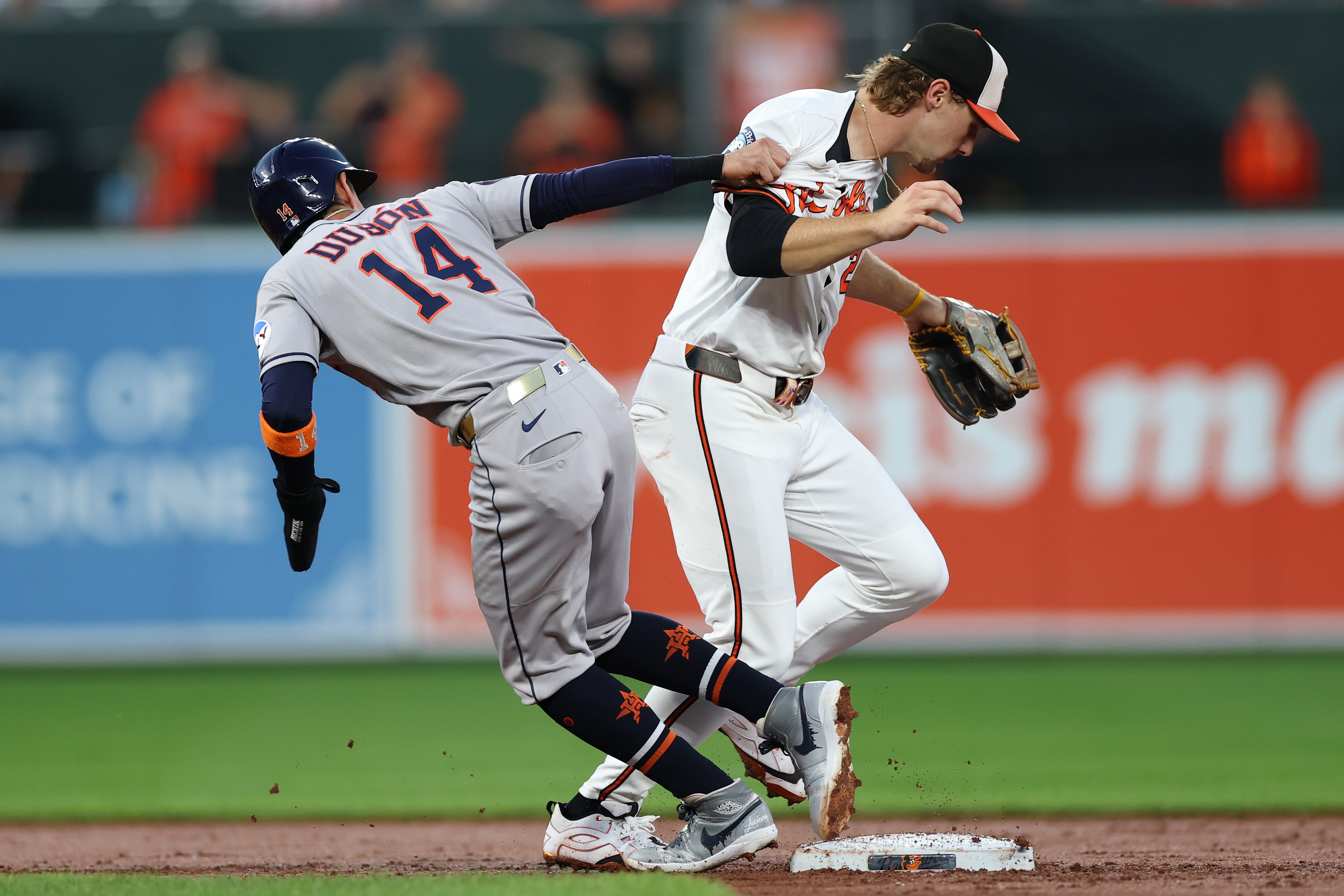 Mauricio Dubón of the Astros collides with Orioles shortstop Gunnar Henderson during the second inning Thursday night at Camden Yards.