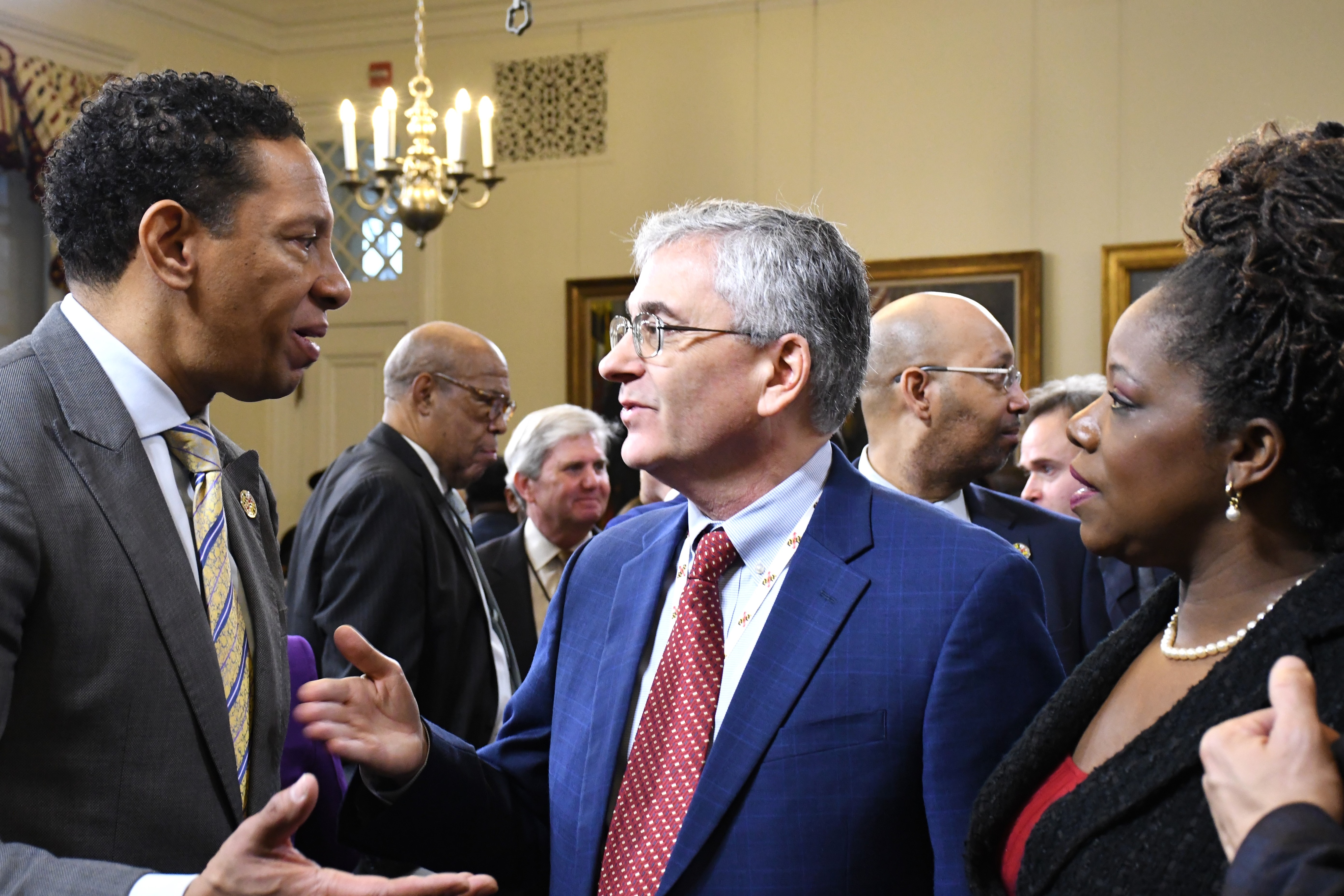 Maryland Department of Juvenile Services Secretary Vincent Schiraldi, center, speaks with Baltimore State's Attorney Ivan Bates, left, and Prince George's County State's Attorney Aisha Braveboy at the State House in Annapolis on Tuesday, Jan. 9, 2024. They spoke after Gov. Wes Moore held a press conference to announce public safety proposals.