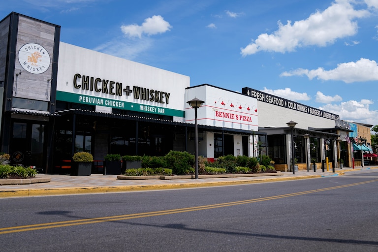 The exteriors of Chicken + Whiskey, Bennie’s Pizza and Walrus Oyster & Ale House at The Mall in Columbia, Md. on Friday, May 2, 2025.