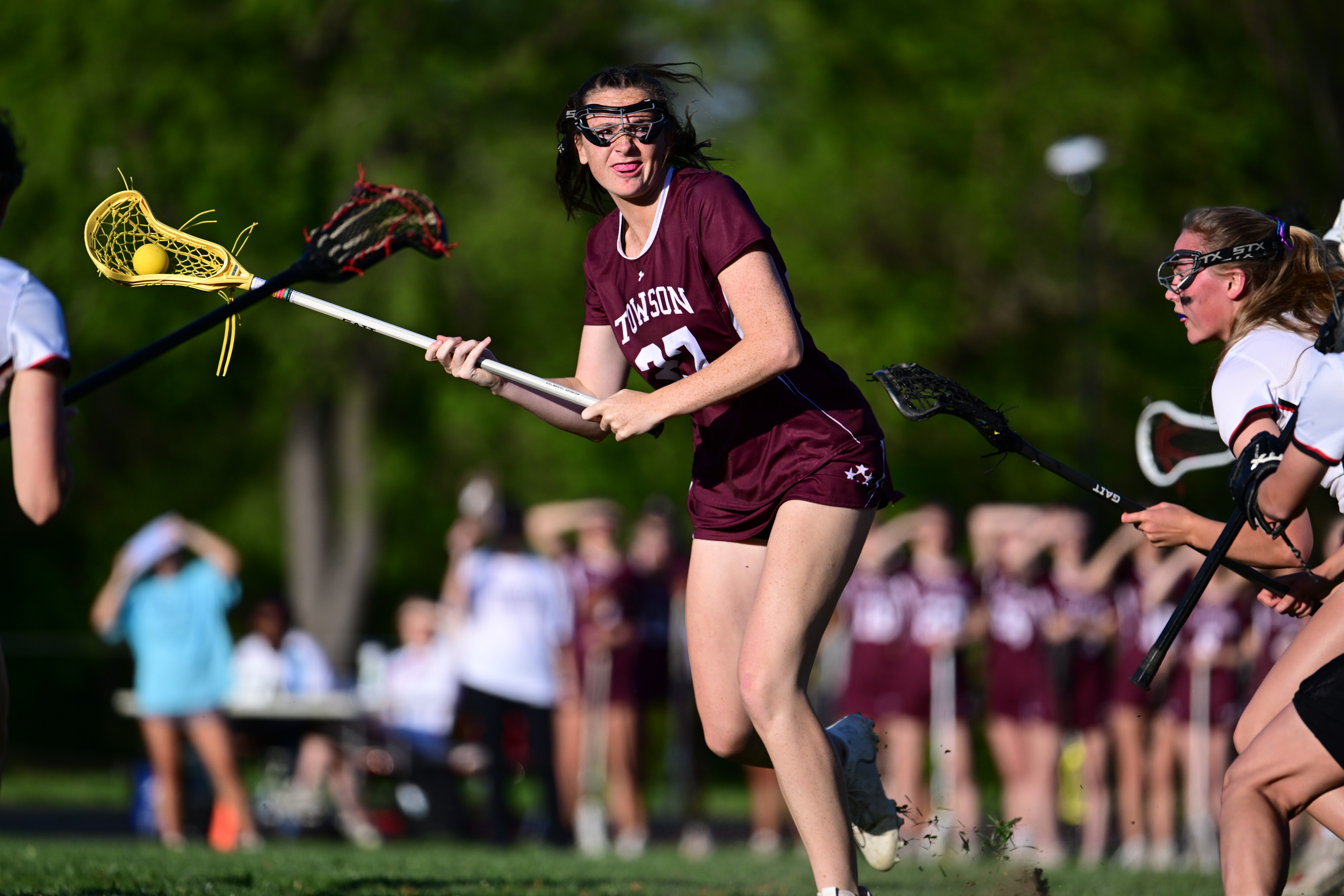 Towson's Finlay Harmon (27) looks to goal in the Generals' rivalry game at Dulaney Wednesday. The No. 15 Generals scored three late extra-man goals to best the Lions, 11-9, and remain undefeated in Baltimore County's Division I.