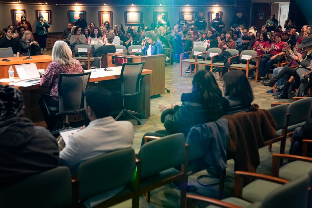 U.S. Rep. Sarah Elfreth, center, testifies during a Howard County Council public hearing at the George Howard Building in Ellicott City, Md., on Wednesday, February 4, 2026. The hearing was meant to record public testimony on an emergency legislation aiming to block private immigrant detention centers in the jurisdiction.