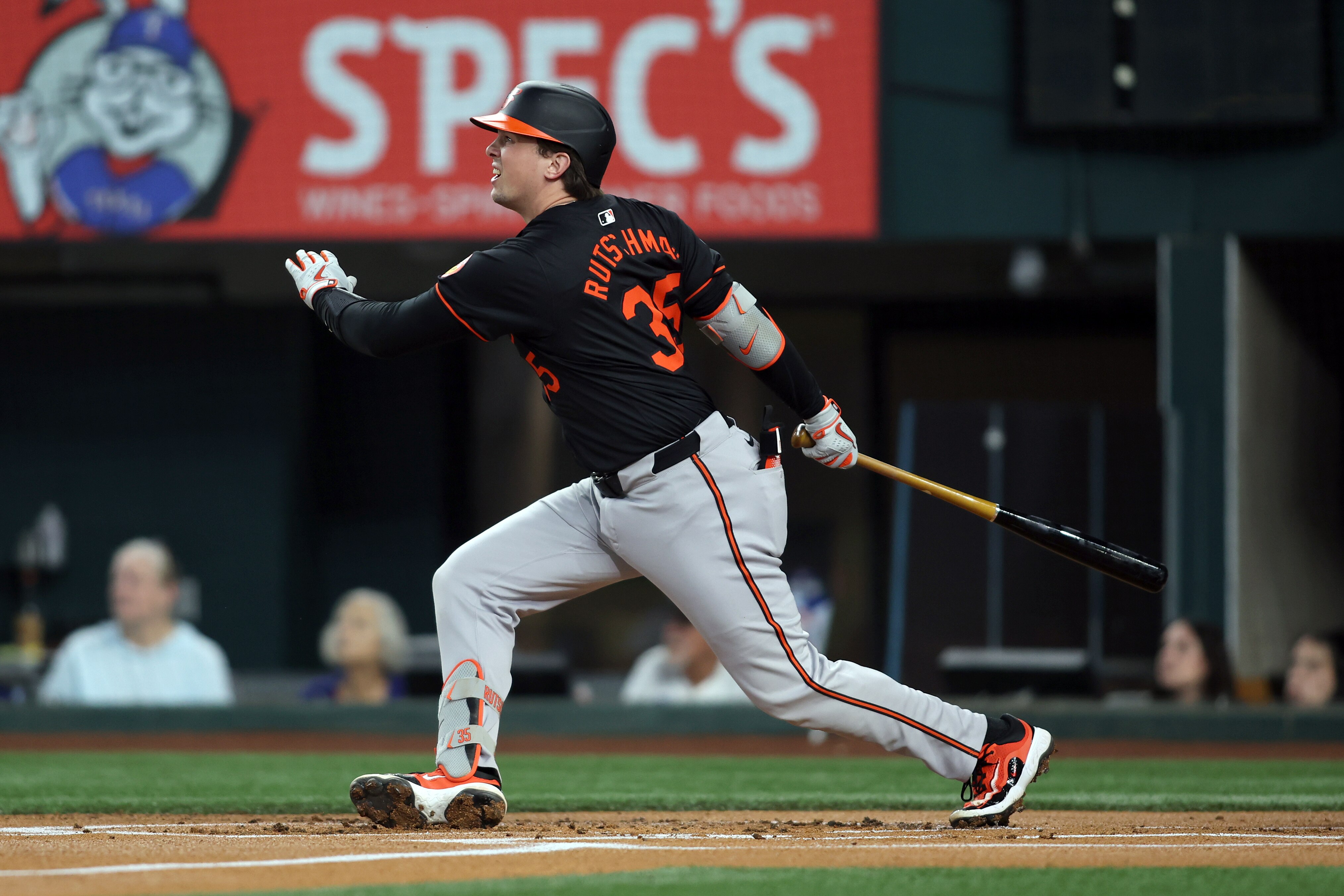 Adley Rutschman hits the first of four Orioles home runs Friday night at Texas, a two-run shot in the first inning.