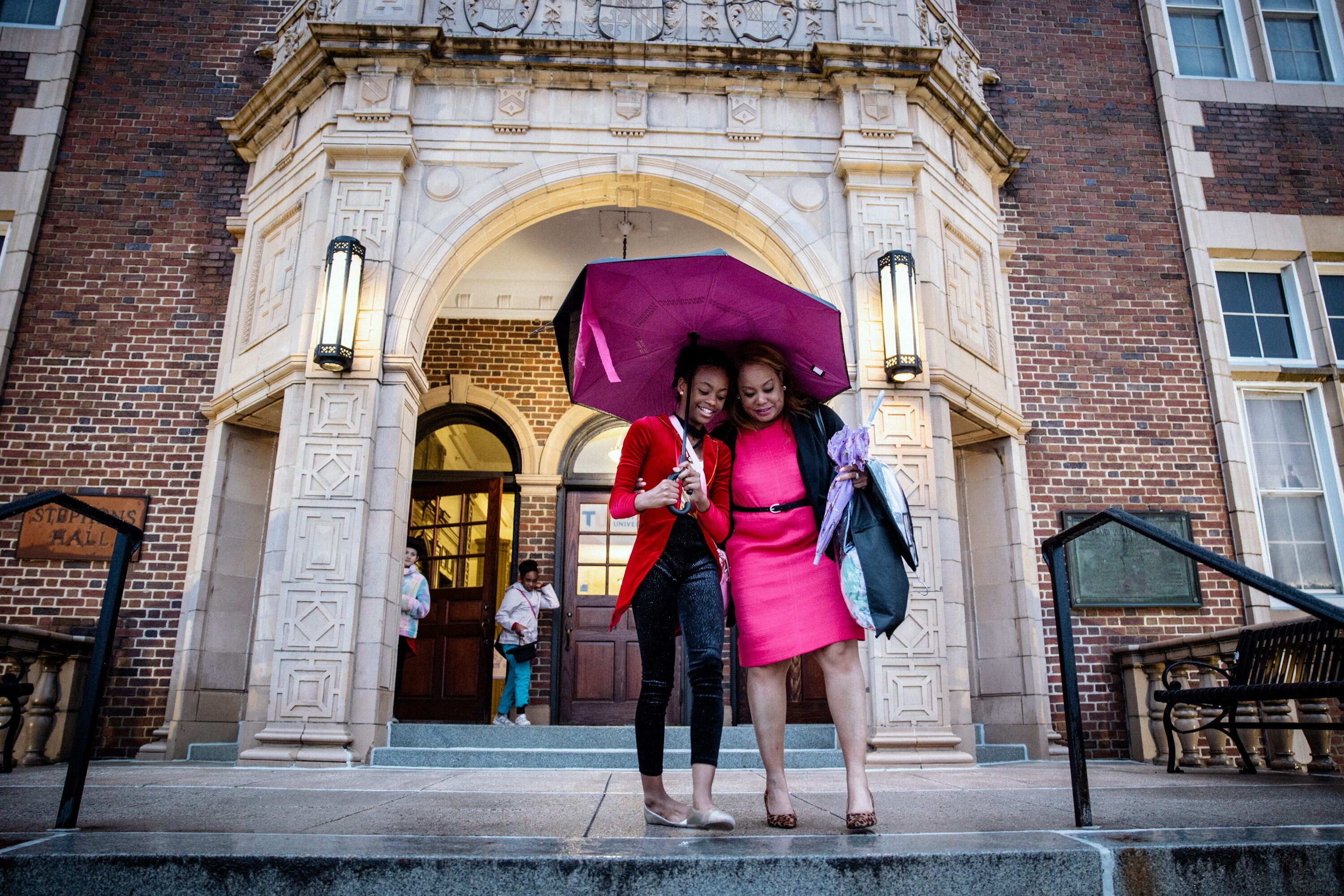 Kim Ross, right, and her daughter Arielle leave Towson University after Arielle’s dress rehearsal for the Morton Street Dance Center last month.