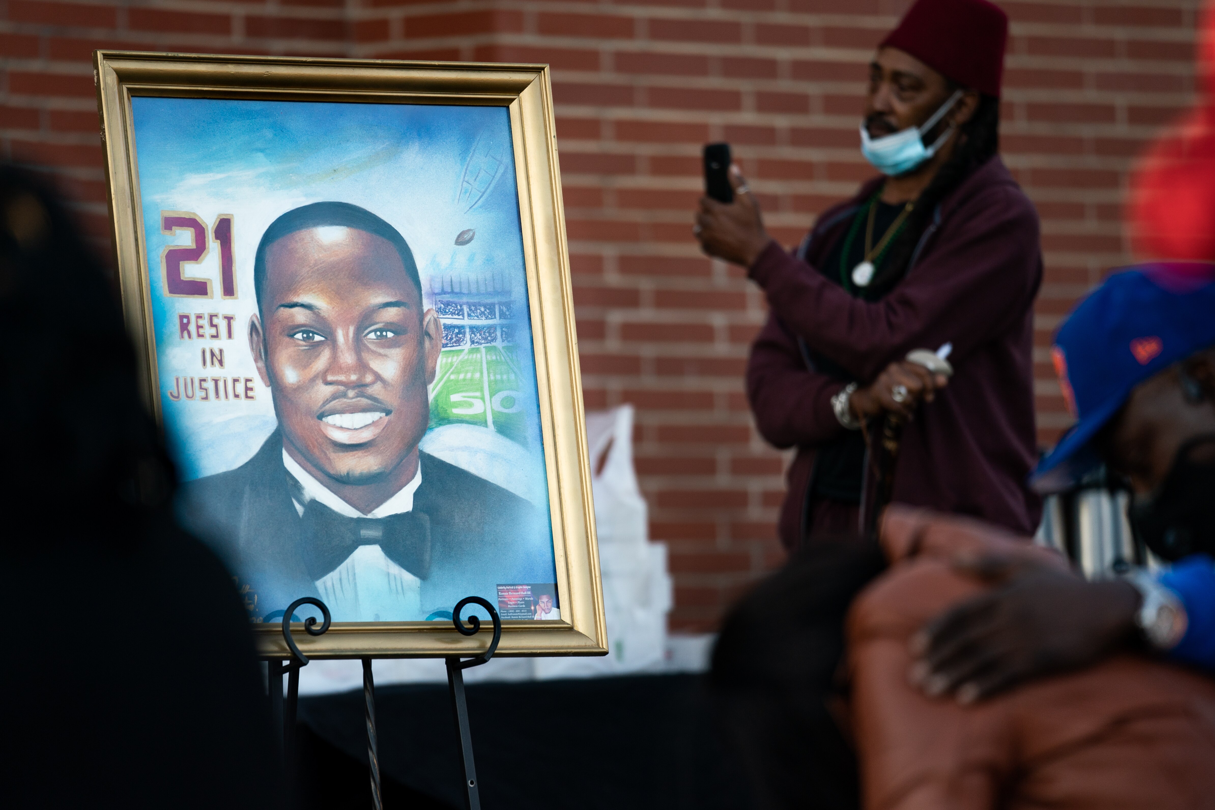 WAYNESBORO, GA - FEBRUARY 23: A painting of Ahmaud Arbery is displayed during a vigil at New Springfield Baptist Church on February 23, 2021 in Waynesboro, Georgia. Arbery, a Black man, was shot and killed while jogging near Brunswick, Georgia a year ago today after being chased by two white men.