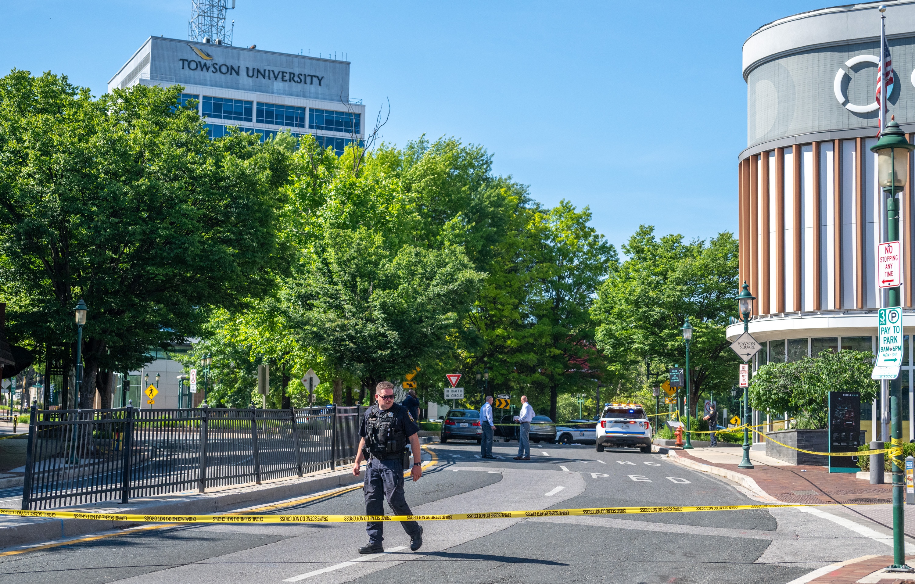 Baltimore County Police officers search for evidence following a shooting that occurred at the traffic circle along York Road in Towson on June 5. On Monday, police announced they'd taken a suspect into custody in the fatal shooting of Towson University student Nasir Majied.