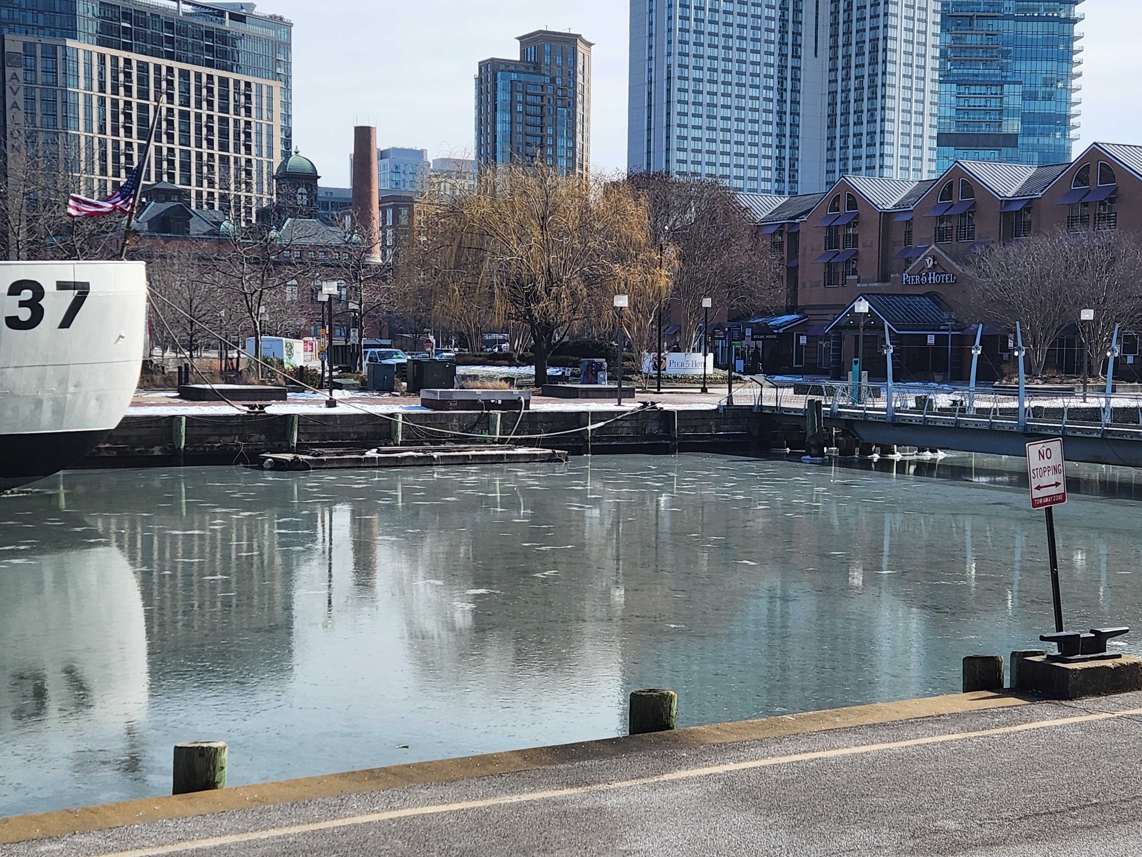 The Inner Harbor is more than 90% frozen and remains motionless along the Coastal Guard ship and museum on Pier 5 on Thursday, January 23, 2025.