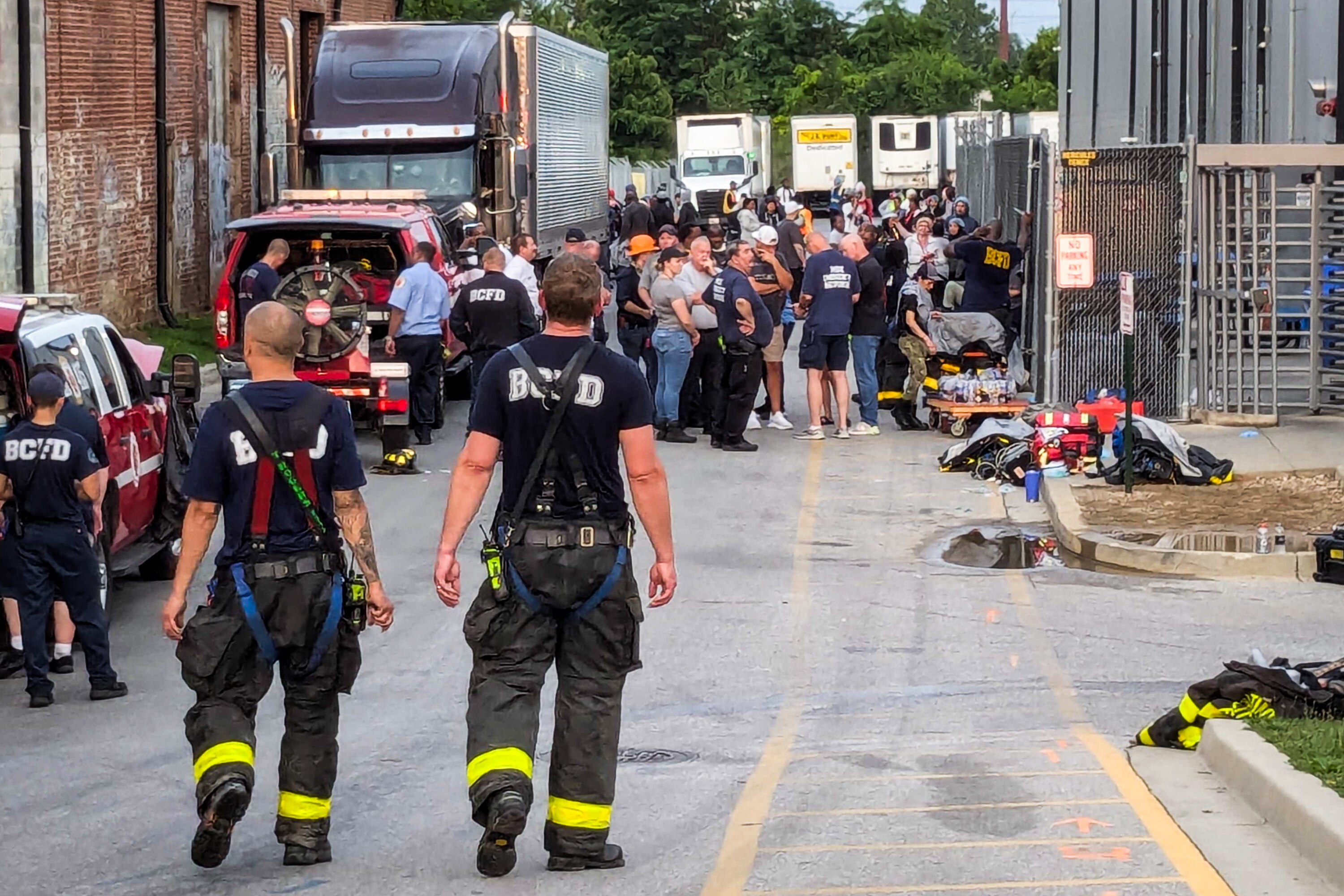 First responders working the scene at a HAZMAT incident at Holly Poultry, a poultry processing plant in Southwest Baltimore on Sunday July 27, 2025. Five people were hospitalized and five more were treated at the scene. A fire department spokesperson said dangerously high levels of carbon dioxide were found inside the plant.