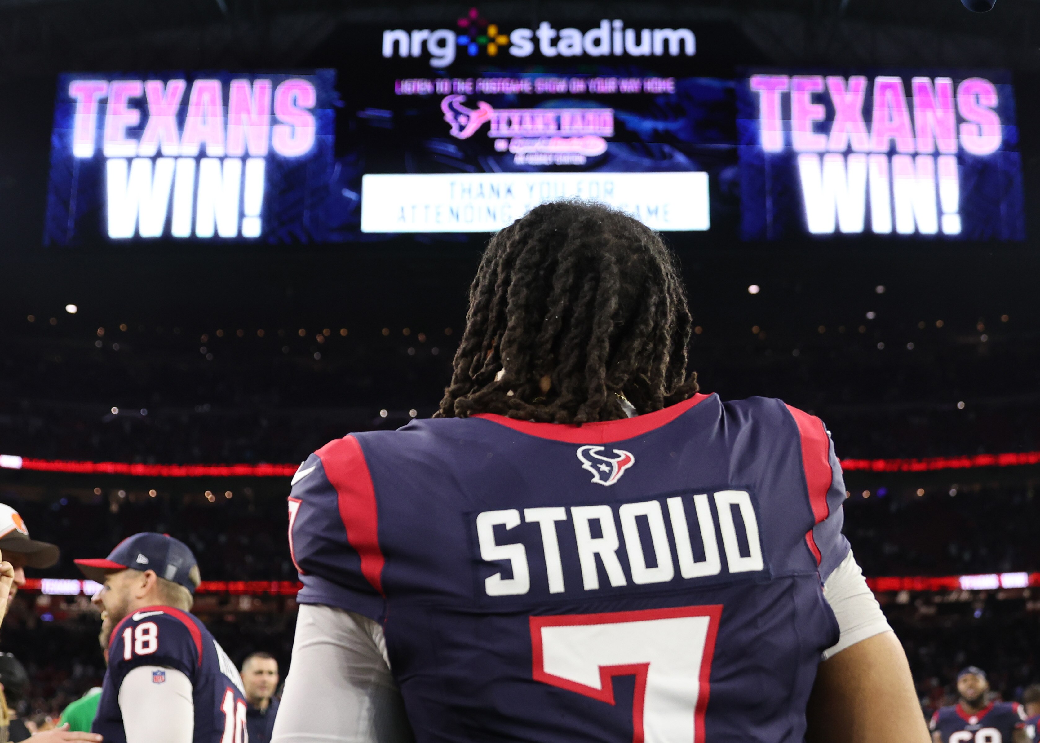 C.J. Stroud #7 of the Houston Texans celebrates after defeating the Cleveland Browns in the AFC Wild Card Playoffs at NRG Stadium on Jan. 13, 2024, in Houston, Texas.