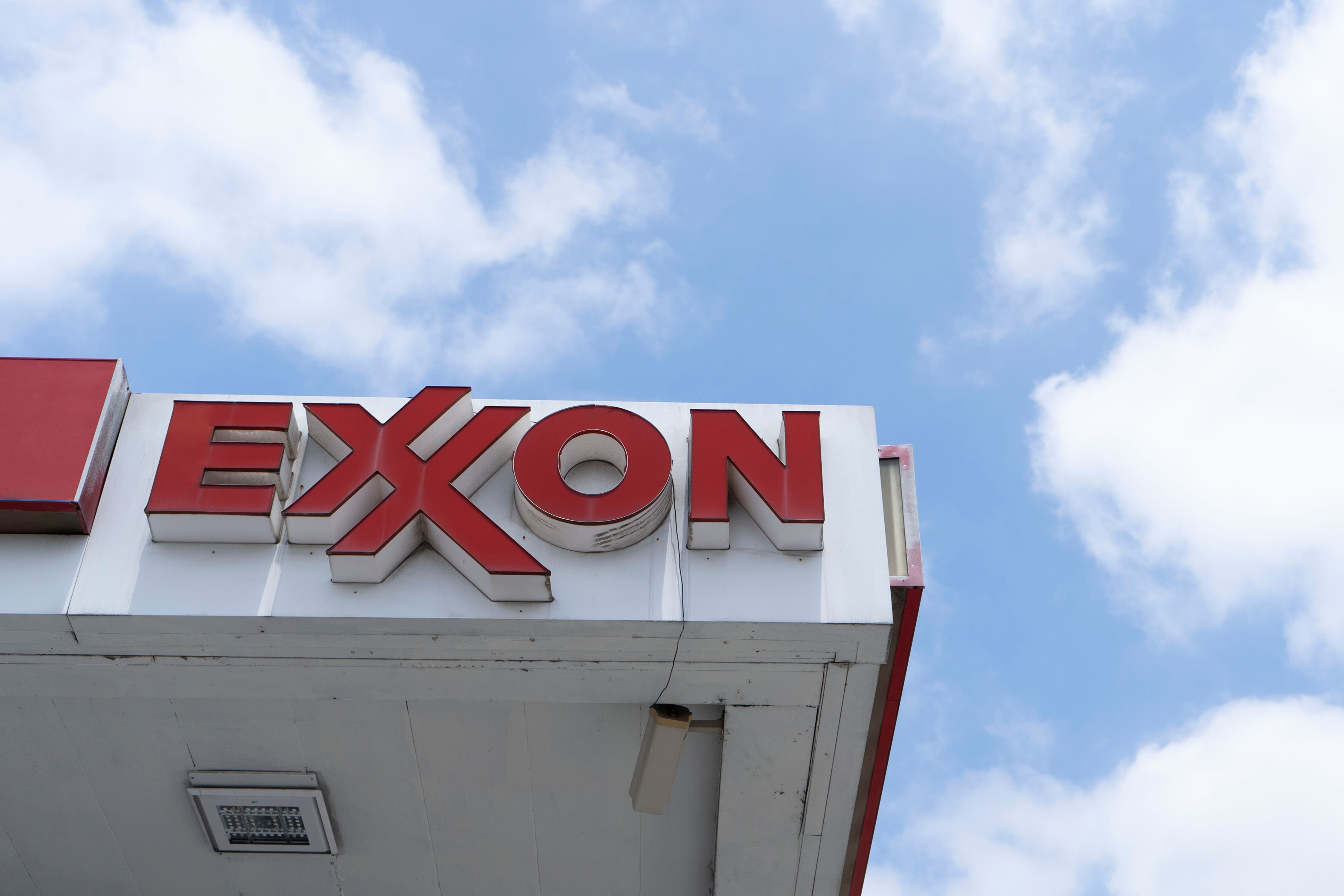 An Exxon gas station in Baltimore. A state commission has recommended charging energy producers like ExxonMobil for the state's costs associated with climate change.