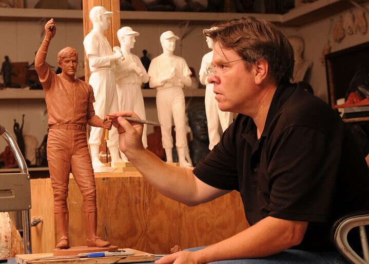 Artist Toby Mendez works on a sculpture of Boston Red Sox great Carl Yastrzemski.