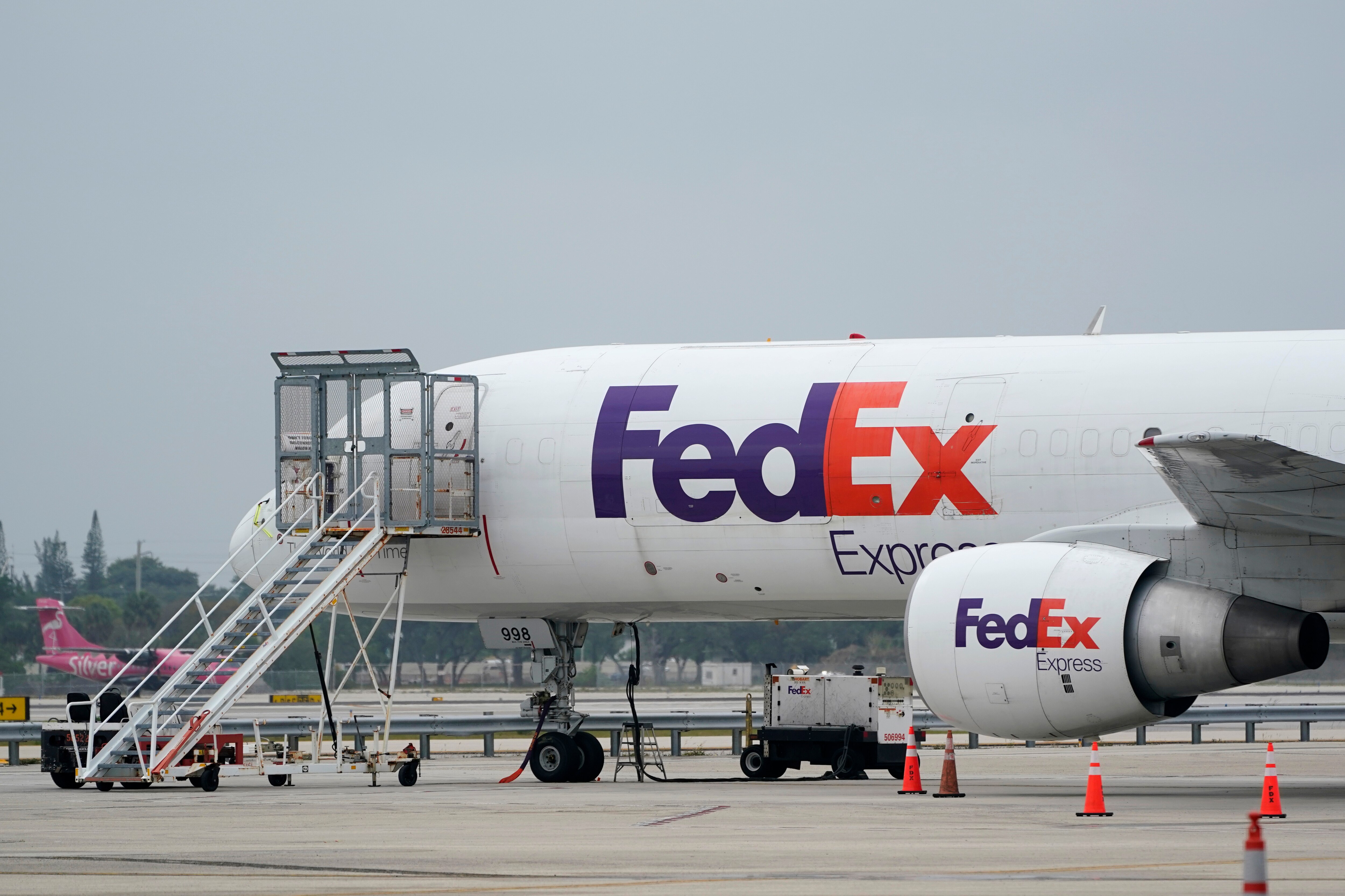 FILE - A FedEx cargo plane is shown on the tarmac at Fort Lauderdale-Hollywood International Airport, Tuesday, April 20, 2021, in Fort Lauderdale, Fla.