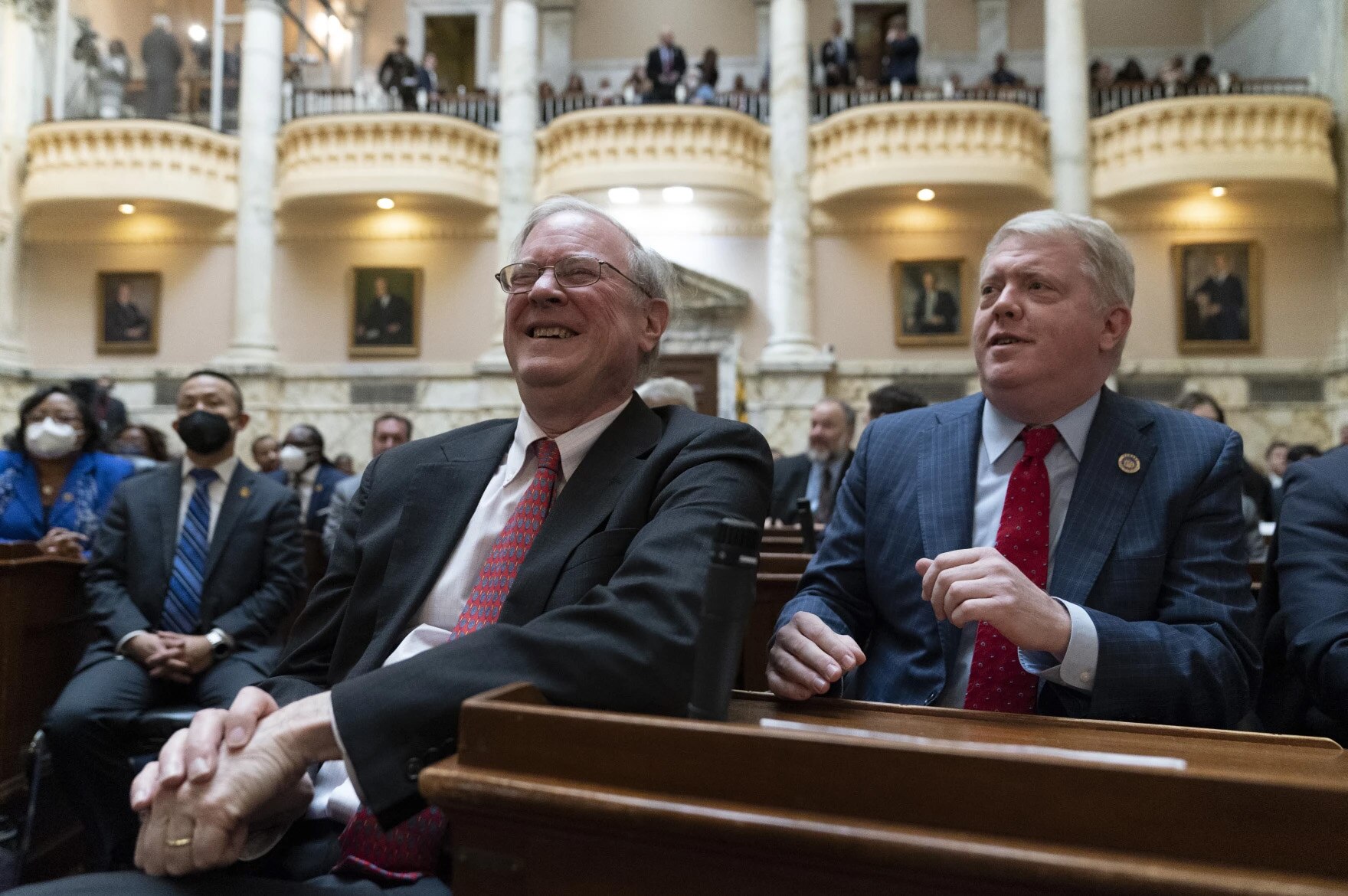 Maryland state Sen. Chris West, left, a Republican from Baltimore County, reacts with state Del. Jason Buckel, a Republican from Allegany County, as they wait for Gov. Wes Moore to deliver his first state of the state address, two weeks after being sworn as governor, Wednesday, Feb. 1, 2023, in Annapolis, Md.