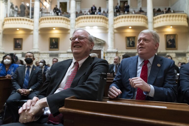 Maryland state Sen. Chris West, left, a Republican from Baltimore County, reacts with state Del. Jason Buckel, a Republican from Allegany County, as they wait for Gov. Wes Moore to deliver his first state of the state address, two weeks after being sworn as governor, Wednesday, Feb. 1, 2023, in Annapolis, Md.