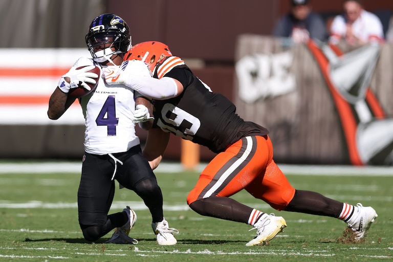 CLEVELAND, OHIO - OCTOBER 18: Carson Schwesinger #49 of the Cleveland Browns tackles Zay Flowers #4 of the Baltimore Ravens during the second quarter of the game at Huntington Bank Field on October 18, 2026 in Cleveland, Ohio. (Photo by Gregory Shamus/Getty Images)