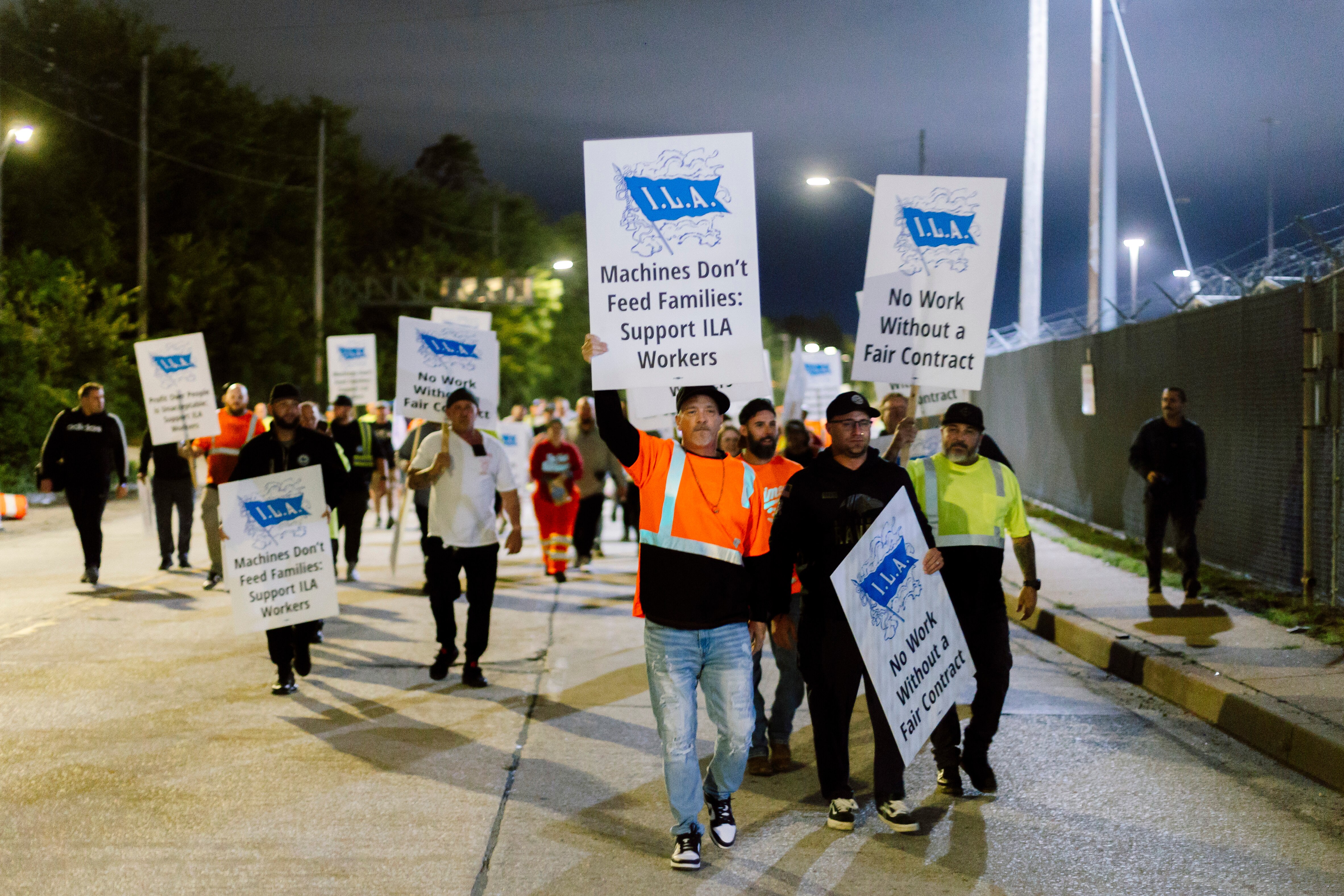 Longshoremen are striking for higher wages — and to stop what they see as the job-killing automation of ports.