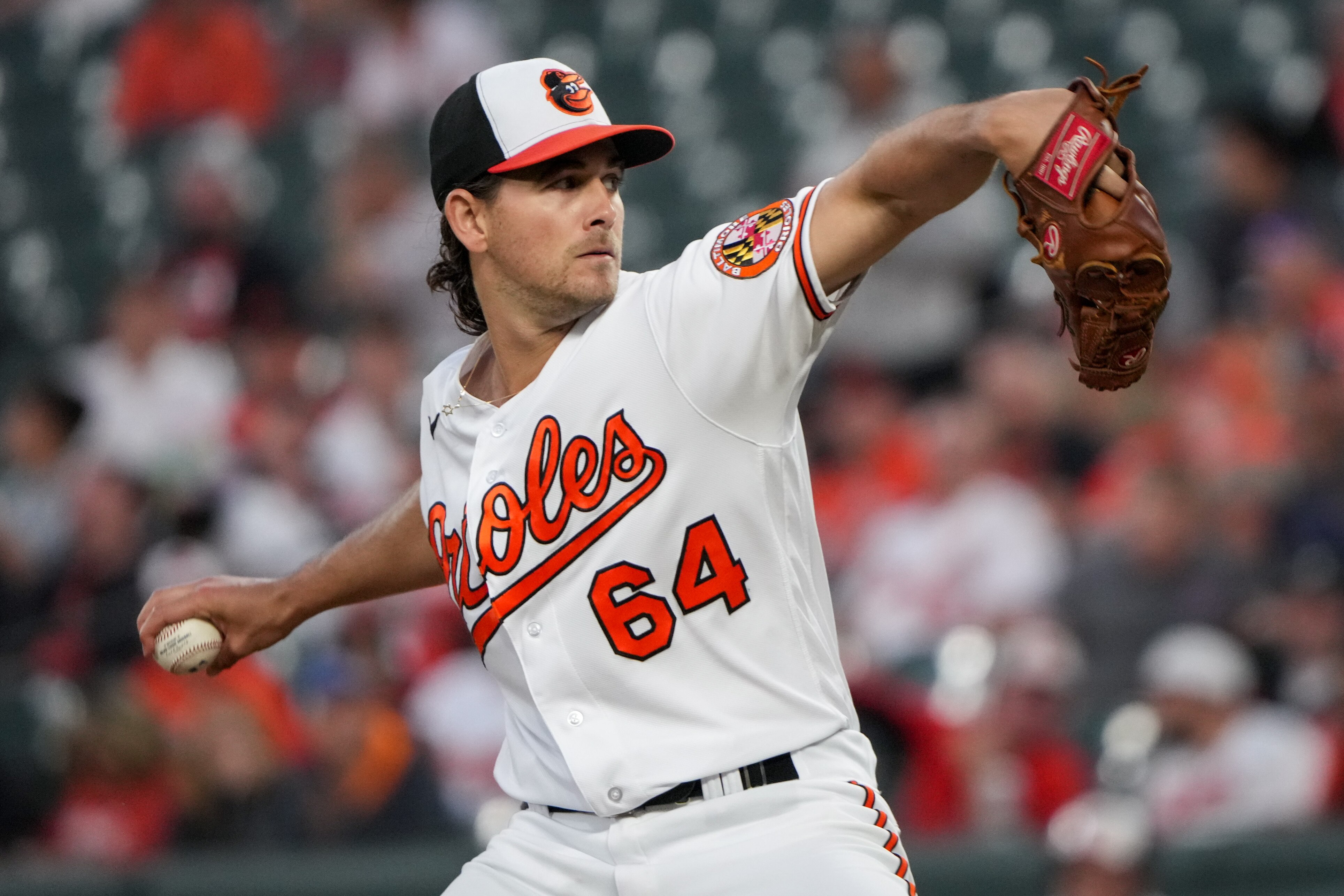 Baltimore Orioles starting pitcher Dean Kremer (64) delivers a pitch in a baseball game against the Tampa Bay Rays at Camden Yards on Wednesday, May 10.
