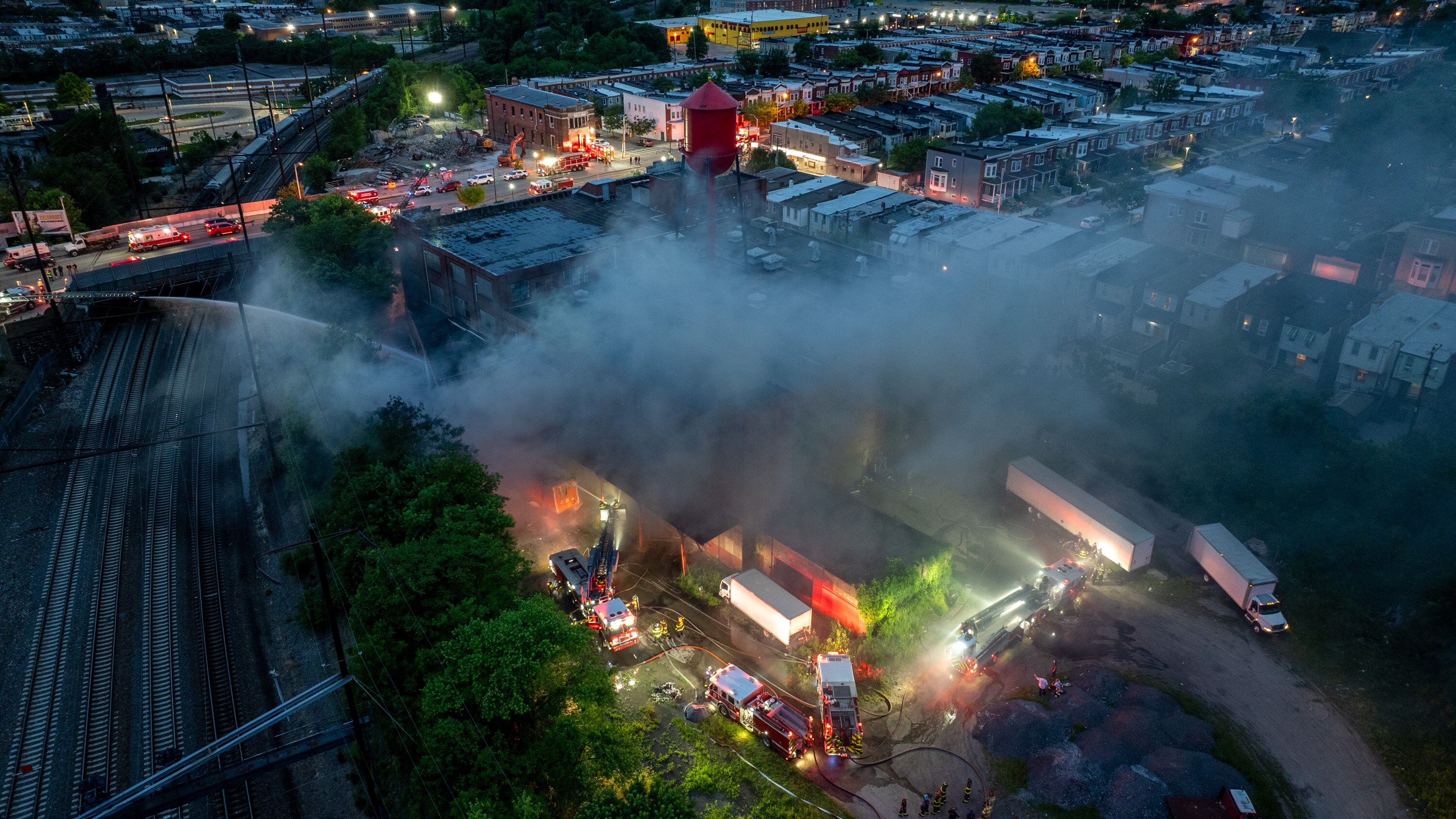 Baltimore firefighters battle a 4-alarm blaze at a warehouse at 2205 W Lanvale Street in West Baltimore Monday evening, May 12, 2025.