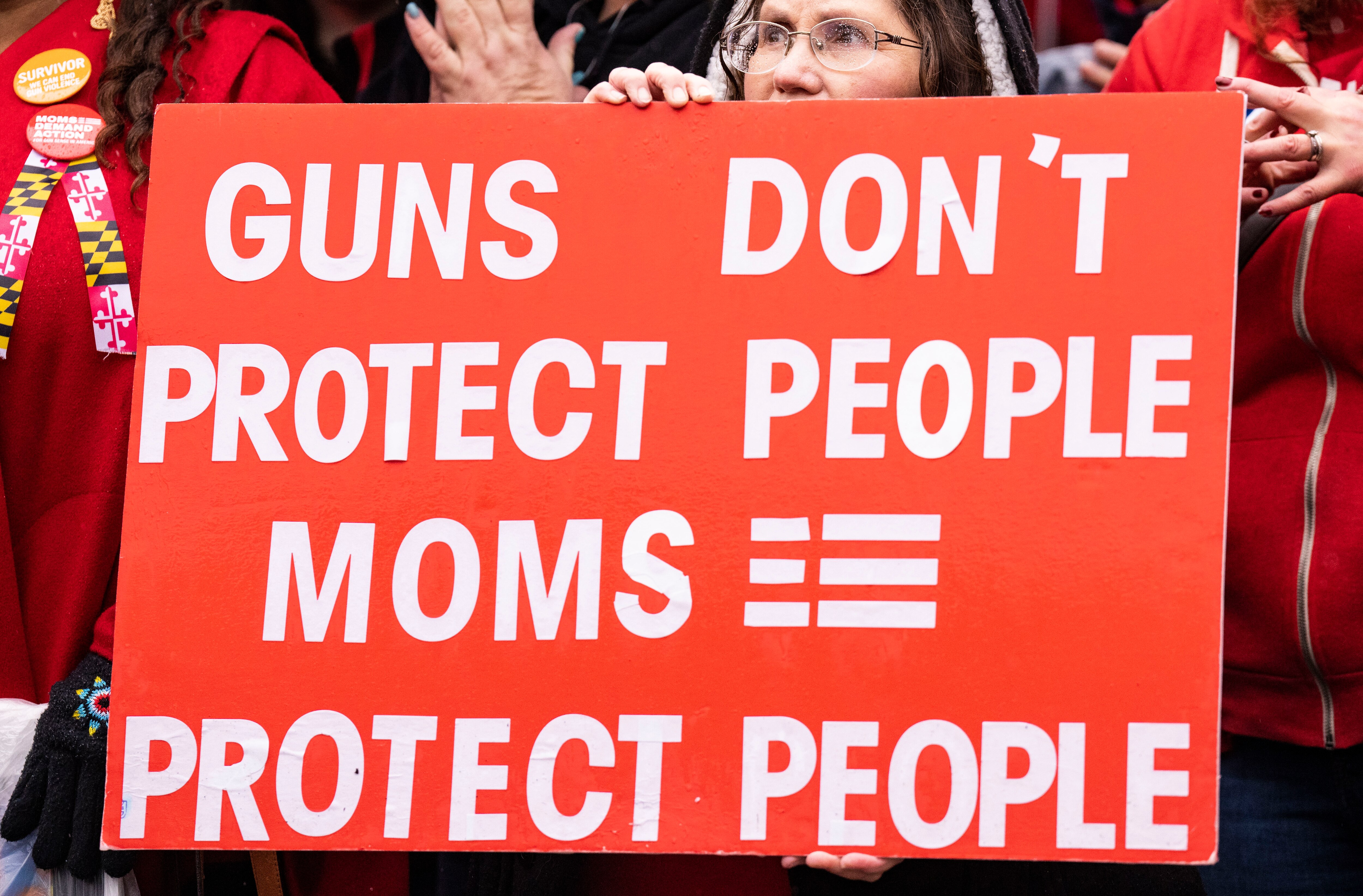Trish Vogel, of Frederick, holds up a signs while speakers talk to the crowd attending the Moms Demand Action Advocacy Day Rally on Lawyer’s Mall, in Annapolis, Tuesday, January 31, 2023.
