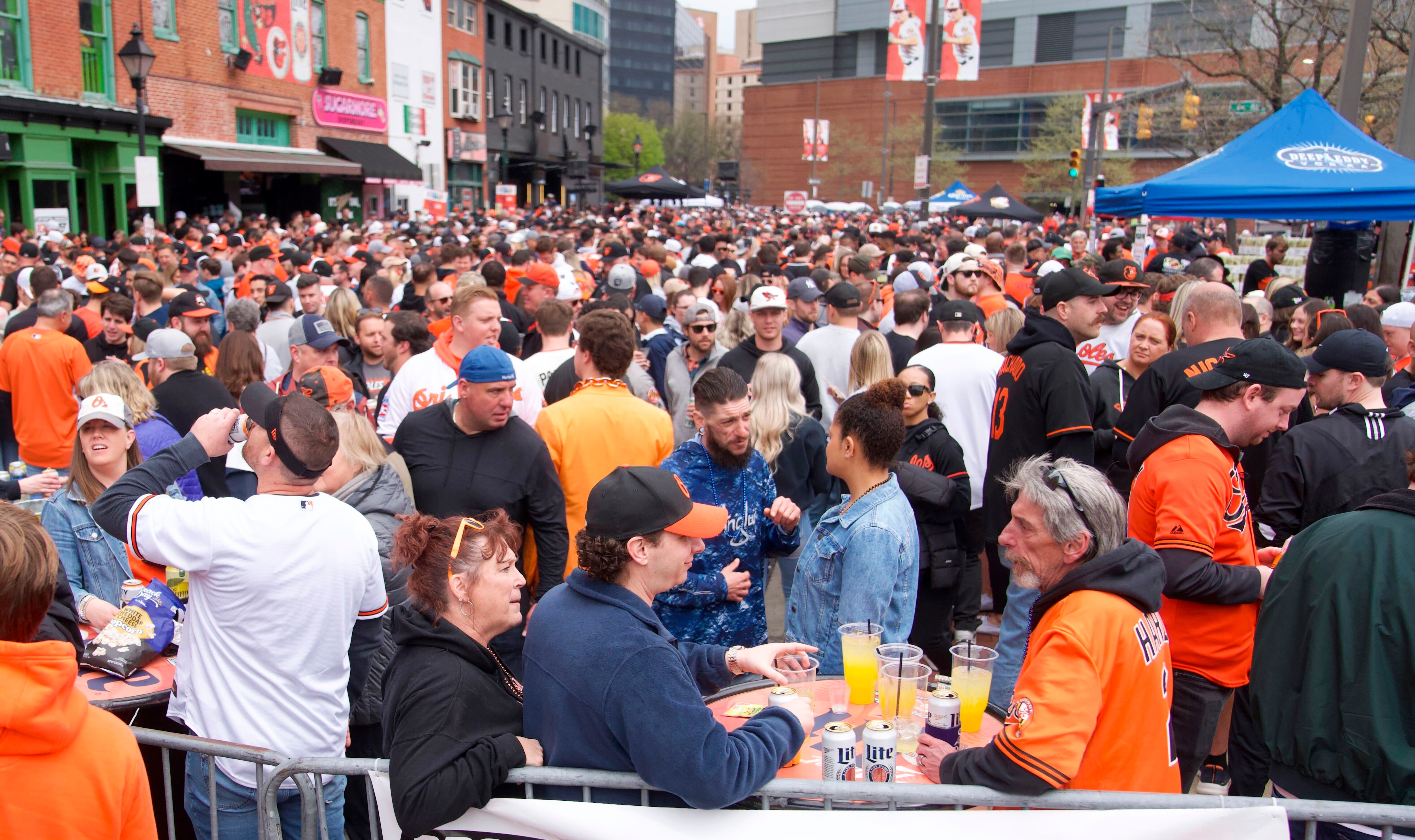 Orioles fans gather on Washington Boulevard outside Camden Yards before the 2023 home opener.