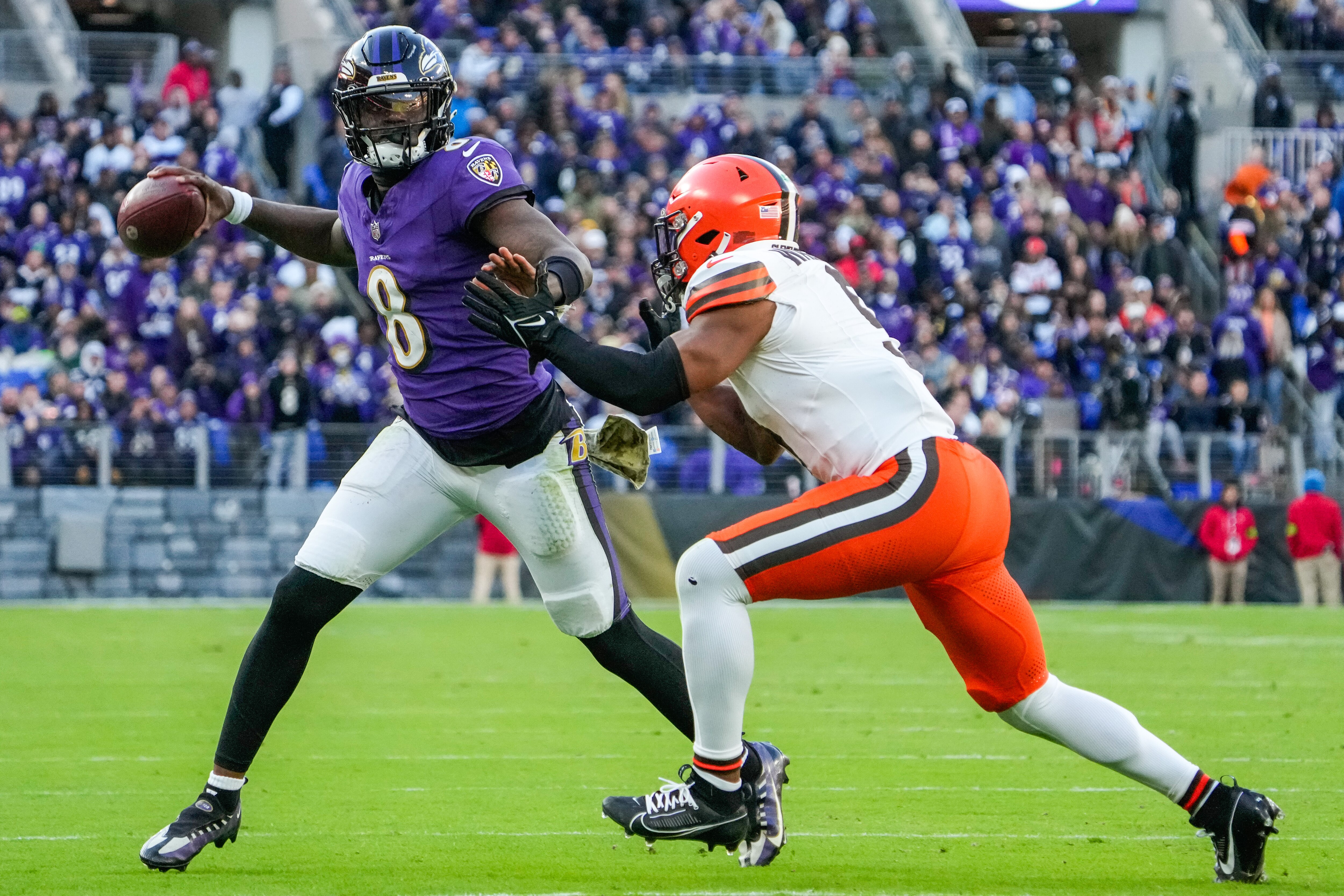 Baltimore Ravens quarterback Lamar Jackson (8) throws the ball during the fourth quarter against the Cleveland Browns at M&T Bank Stadium on Sunday, Nov. 12, 2023.