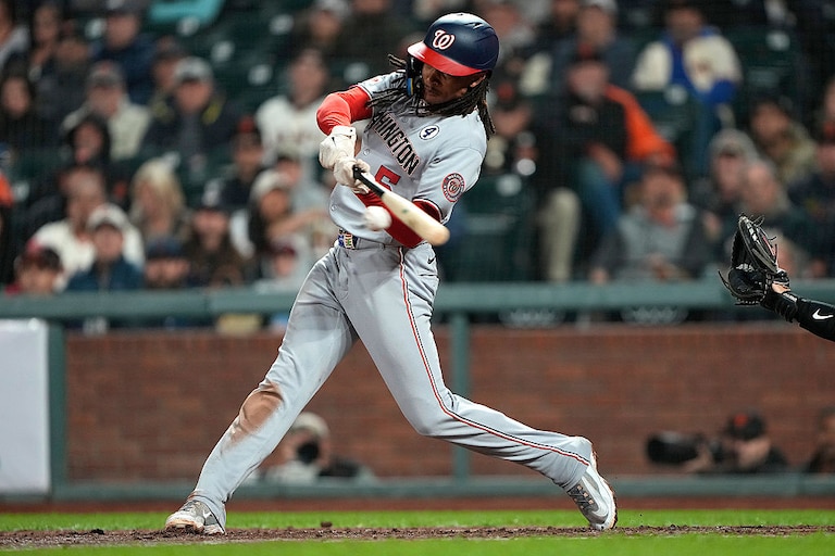 Washington Nationals shortstop CJ Abrams hits a two-run single against the San Francisco Giants in the top of the ninth inning.