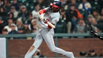Washington Nationals shortstop CJ Abrams hits a two-run single against the San Francisco Giants in the top of the ninth inning.