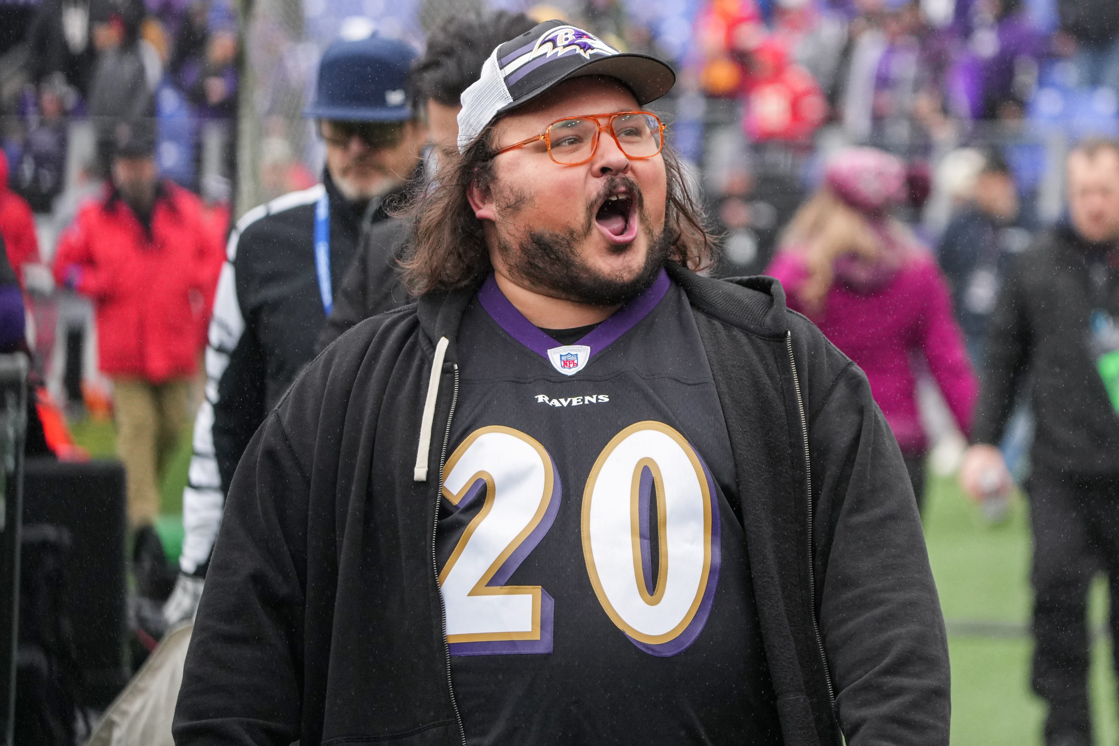 Comedian and Baltimore native Stavros Halkias walks on the sidelines before the Ravens’ AFC championship game at M&T Bank Stadium in January 2024.