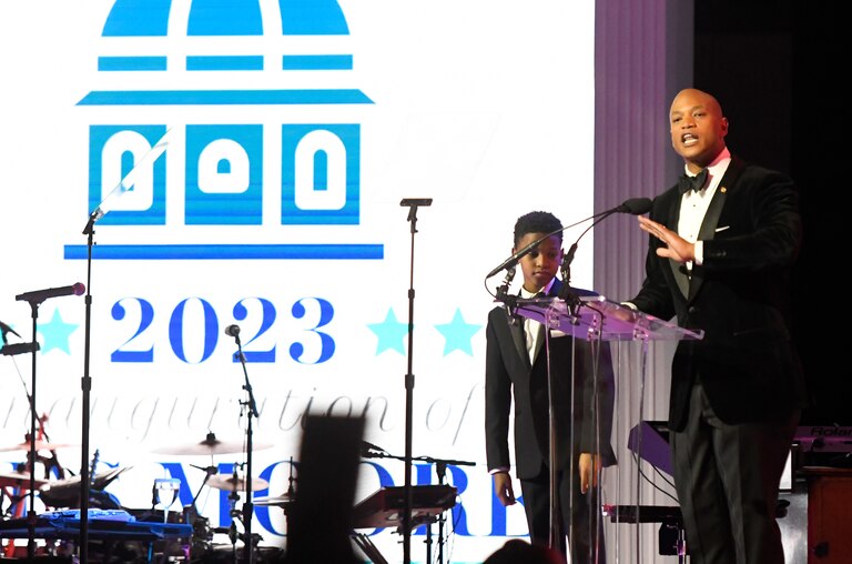 Gov. Wes Moore, with his son, James, 11, speaks during his inaugural ball, Wednesday, Jan. 18, 2023, in Baltimore.