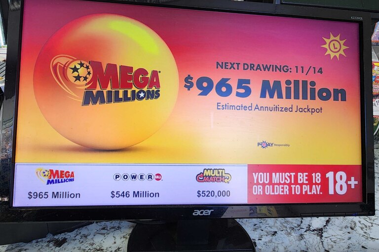A Mega Millions promo at the Triple Fam Mart in Mount Veron shows the $965 million jackpot for the drawing Friday, Nov. 14, 2025.