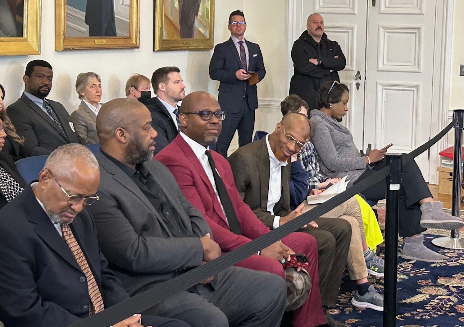 Marando Warthen looks down the row at his lawyers and others who accompanied him to Wednesday's Board of Public Works Meeting.