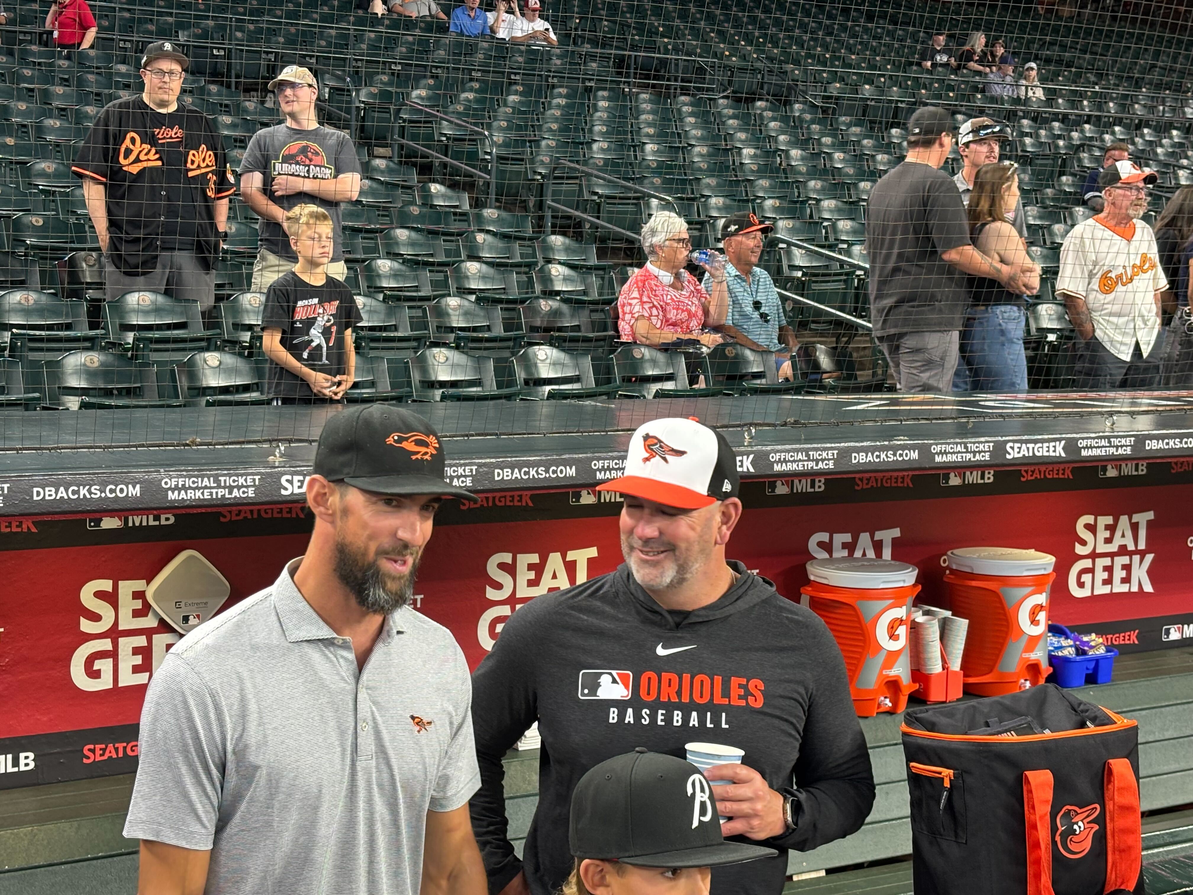 Michael Phelps, the most decorated Olympian ever, stands with Orioles manager Brandon Hyde at Chase Field in Phoenix, Arizona, on April 9.