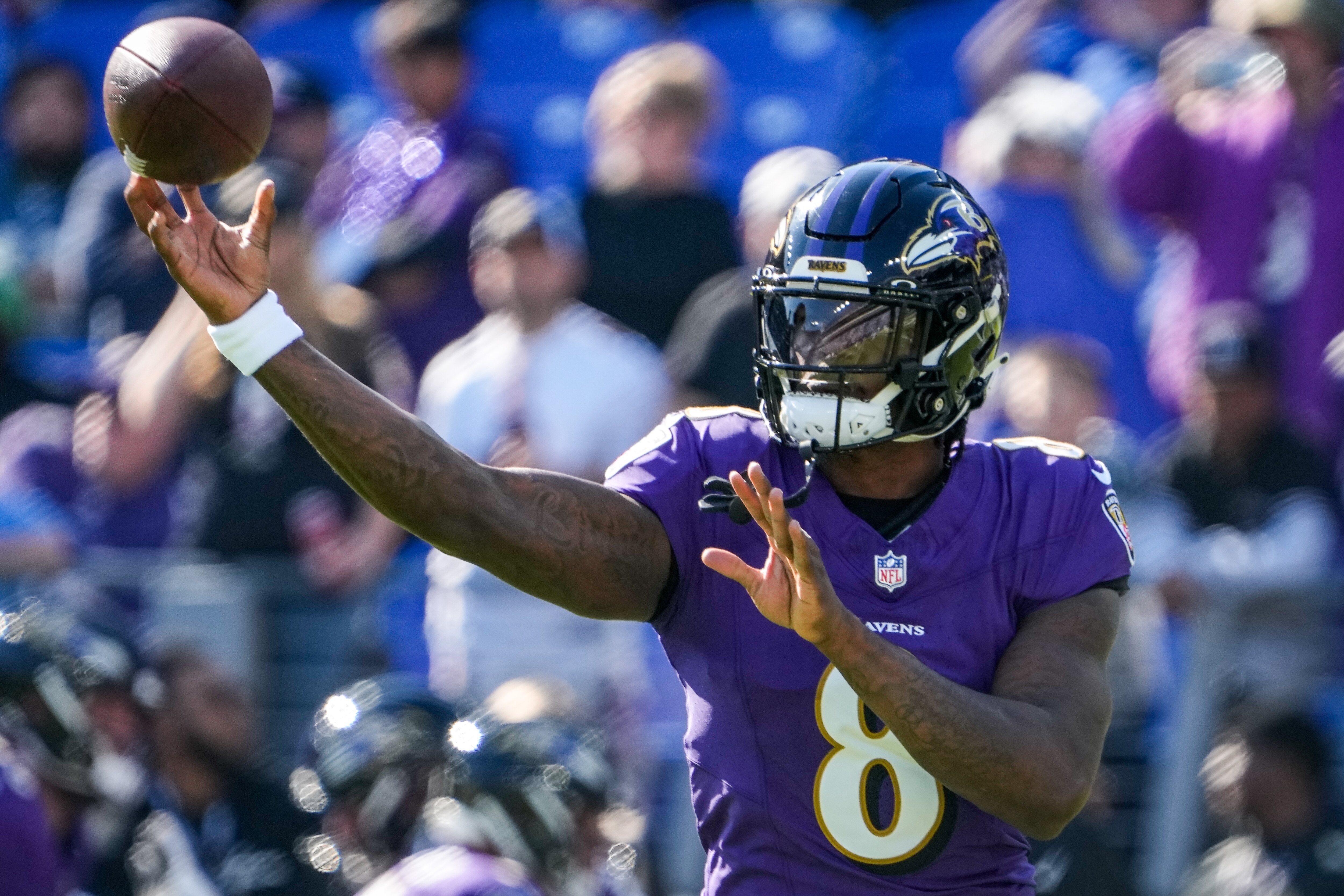 Baltimore Ravens quarterback Lamar Jackson (8) practices before the game against the Seattle Seahawks at M&T Bank Stadium on Sunday, Nov. 5, 2023.